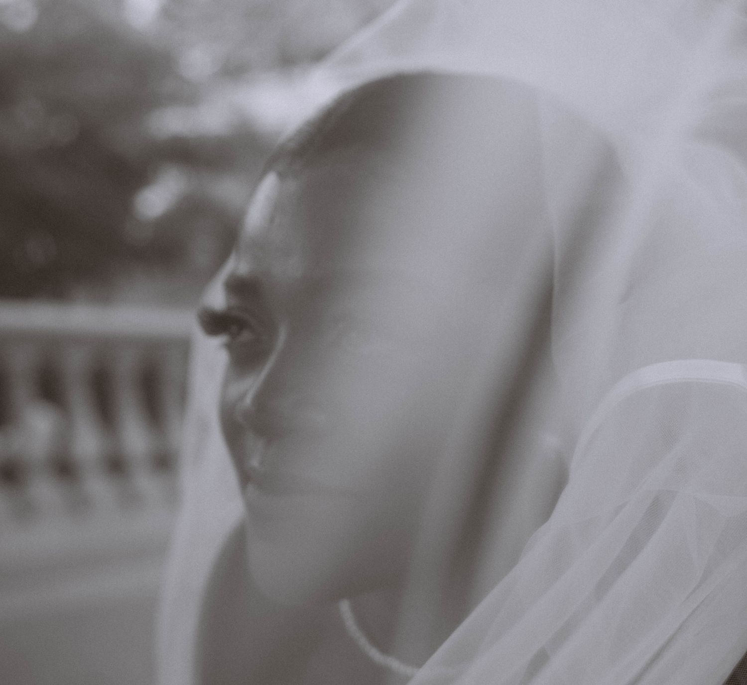 Ravens Ait wedding bride portrait through veil soft focus black and white emotional bridal photography London