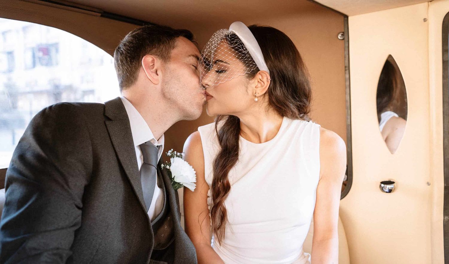 Bride and groom kissing during during wedding portraits at St George Hall