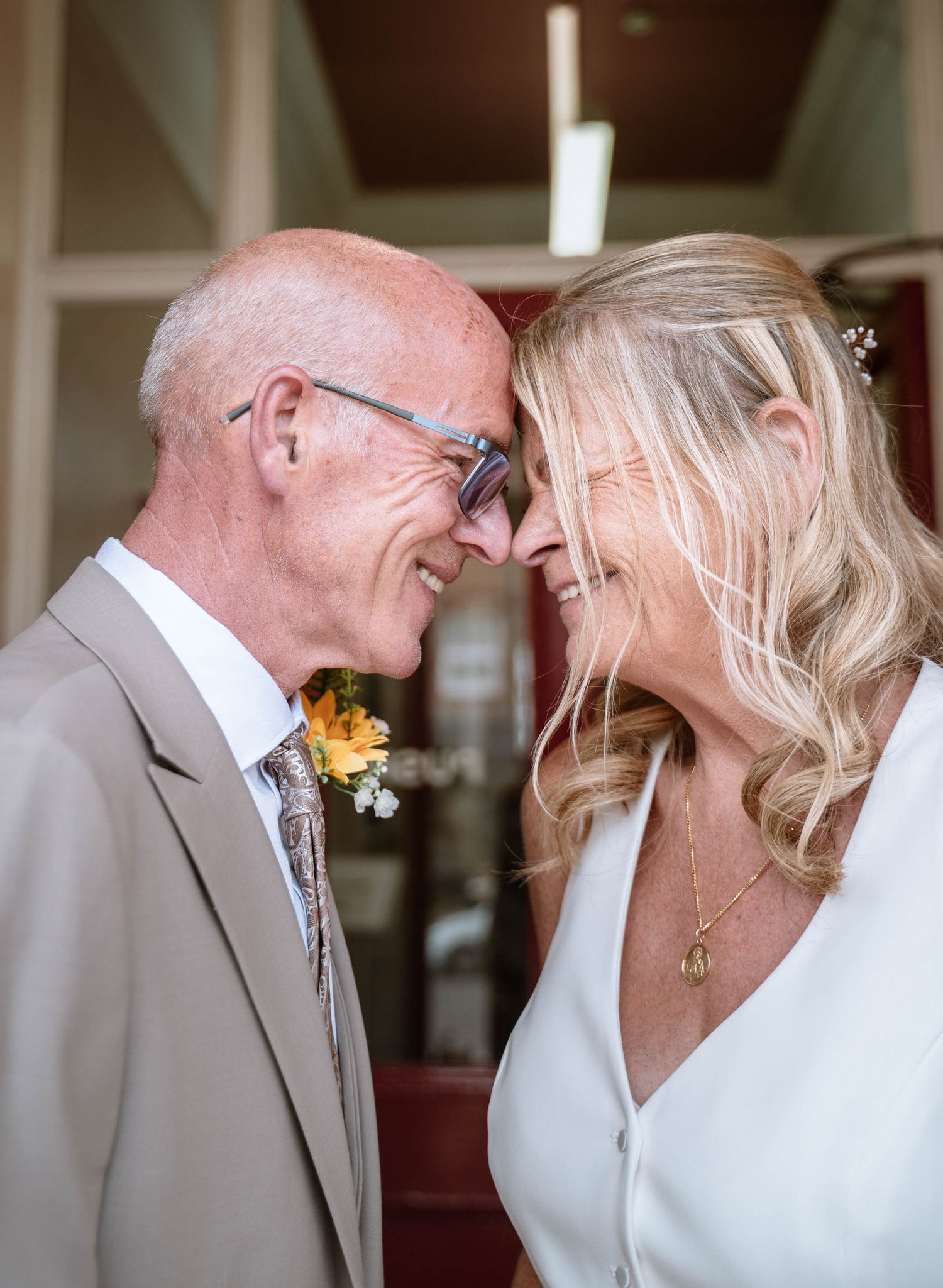 Newlywed couple sharing a moment outside Waterloo Town Hall