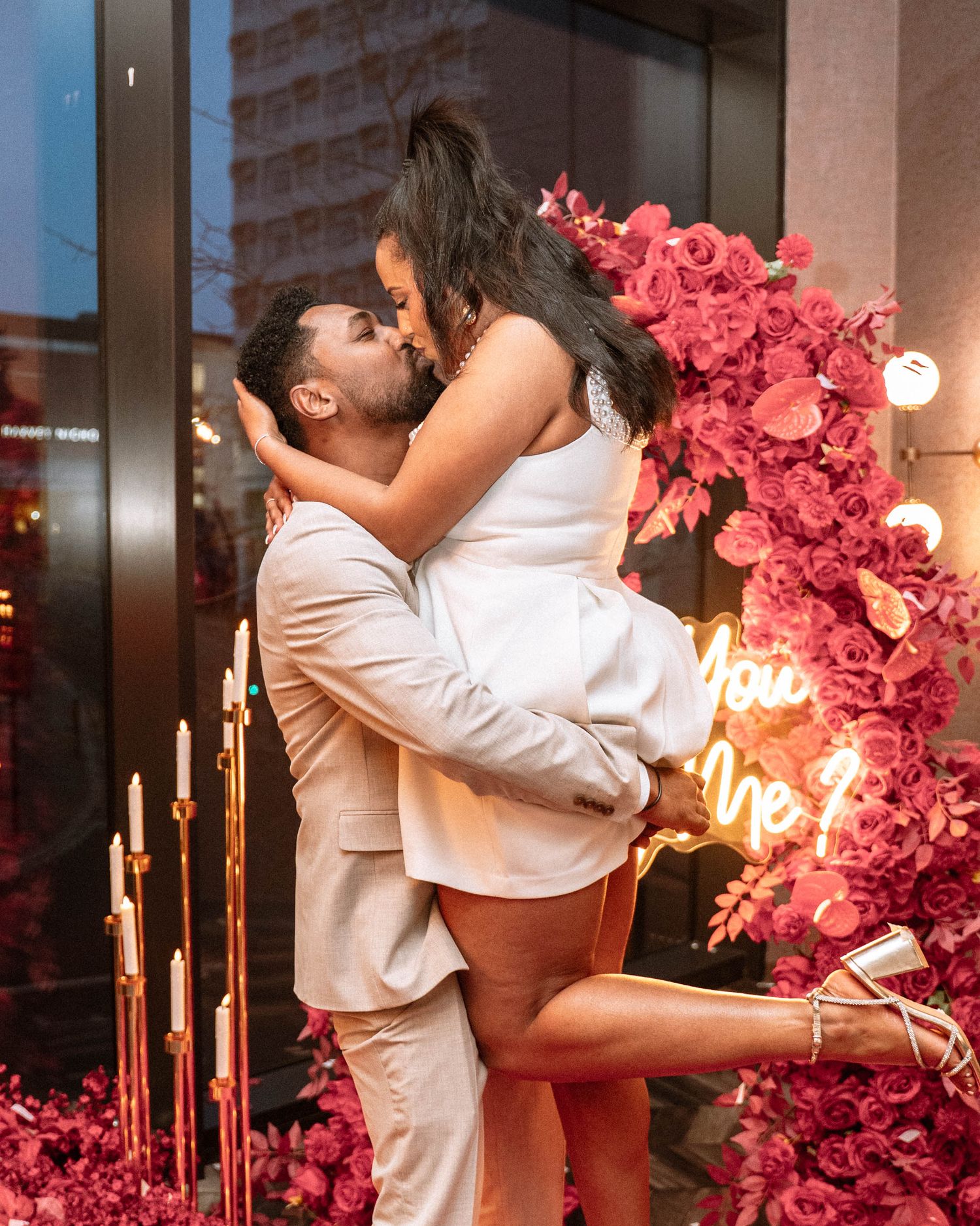 Woman kissing her partner during a Manchester proposal photography session