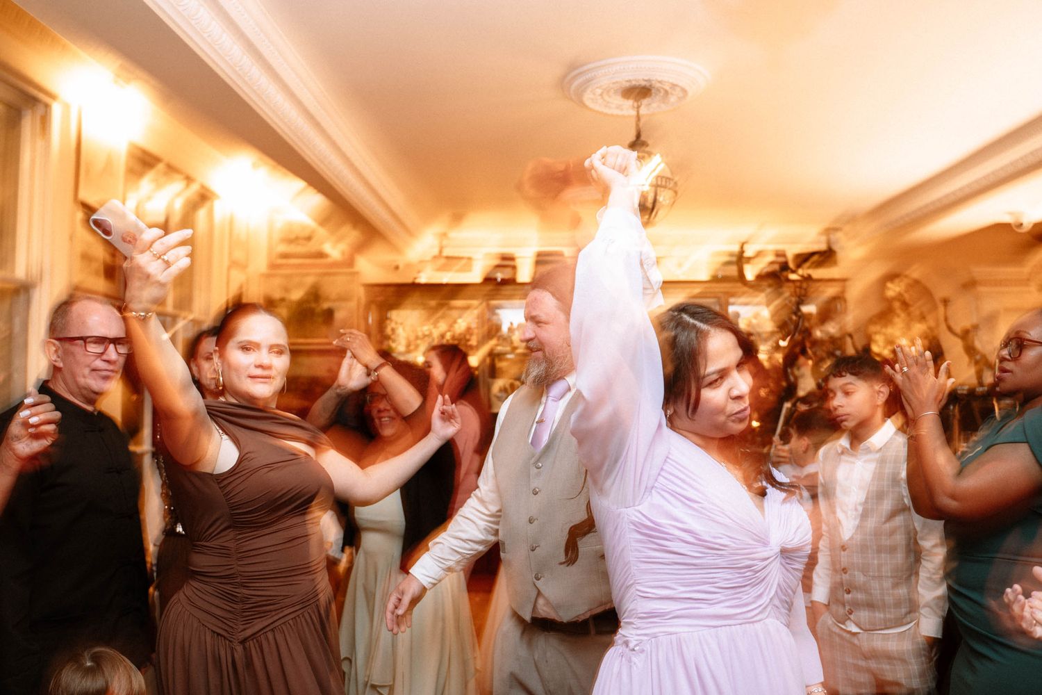 London Trafalgar Tavern wedding reception dance floor guests celebrating lively party atmosphere candid moment