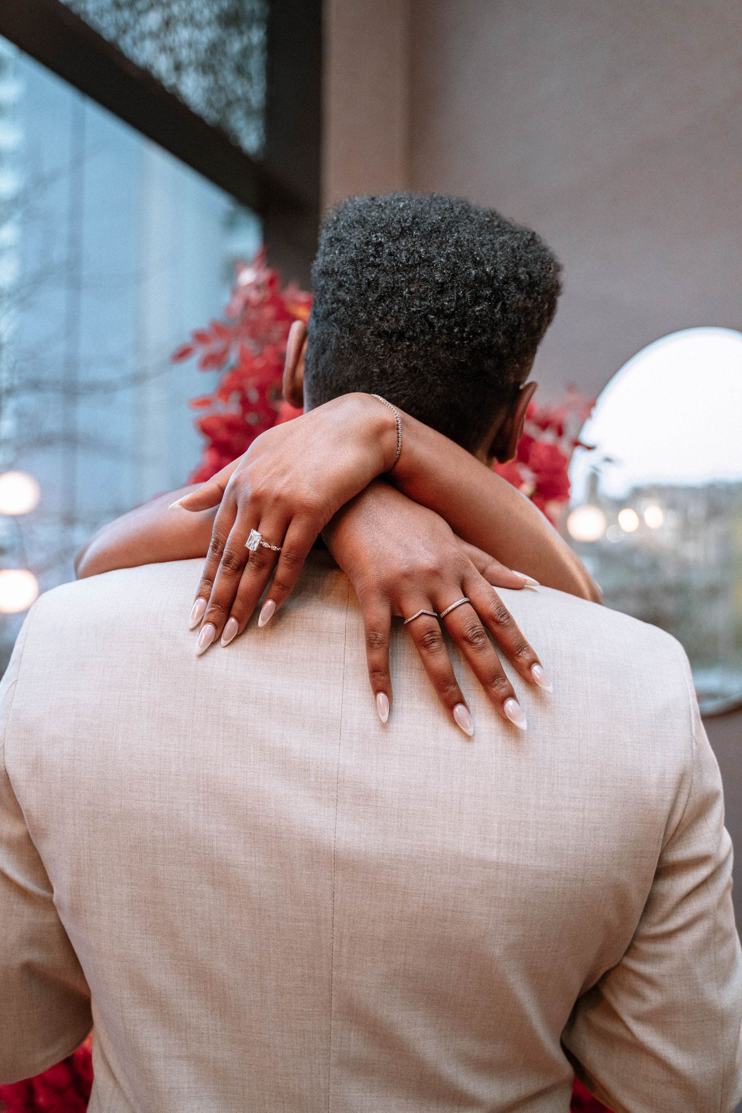 Couple celebrating after a surprise proposal in Manchester city centre