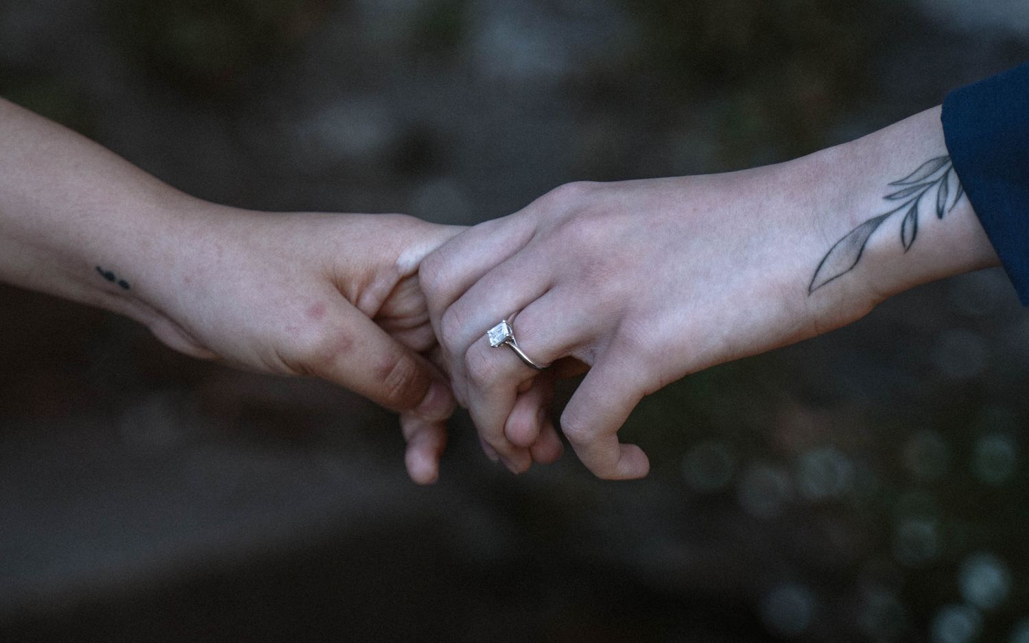 A engagement shoot of a queer couple in Cardiff holding hands