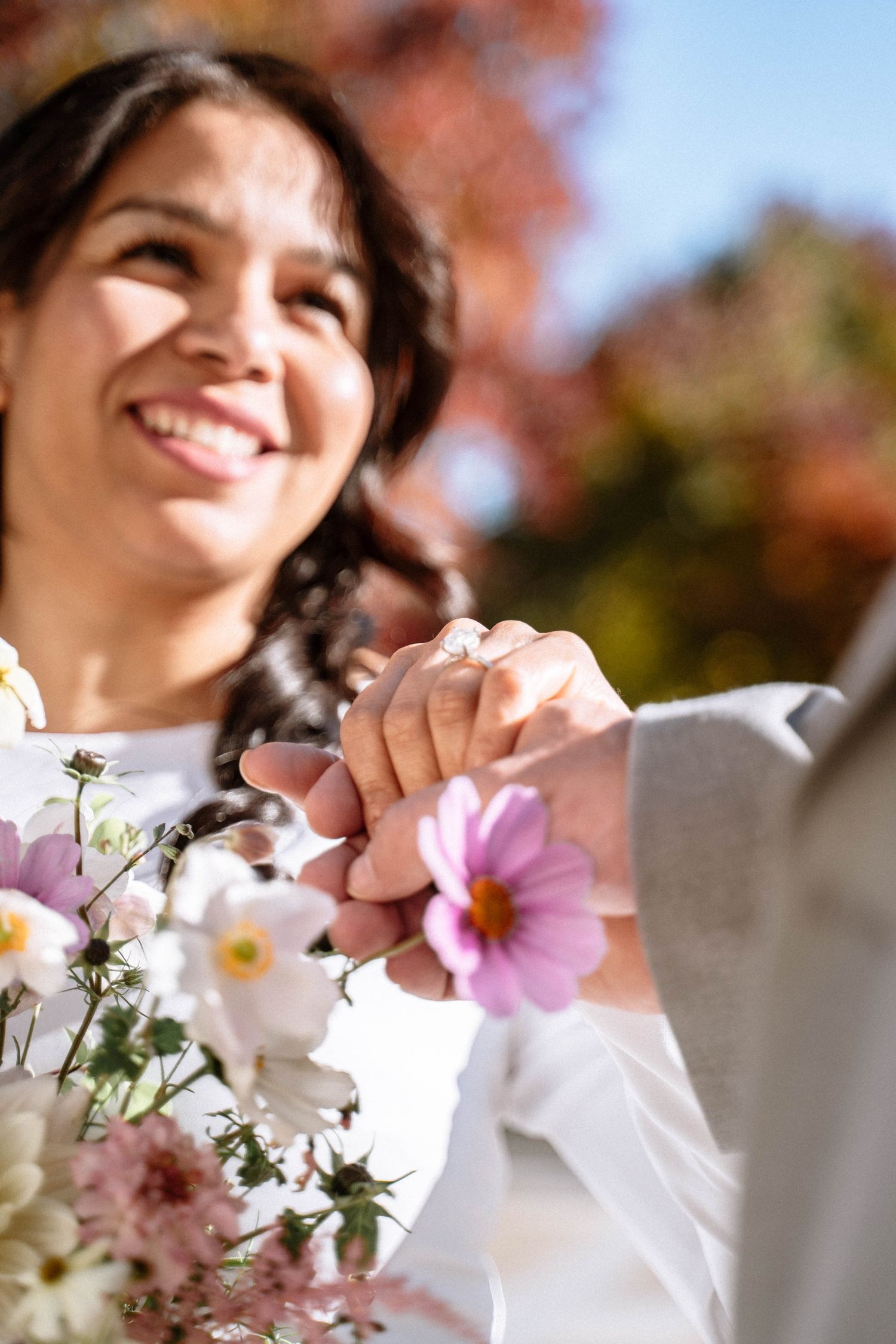 Bride smiling holding bouquet during LDS wedding in London