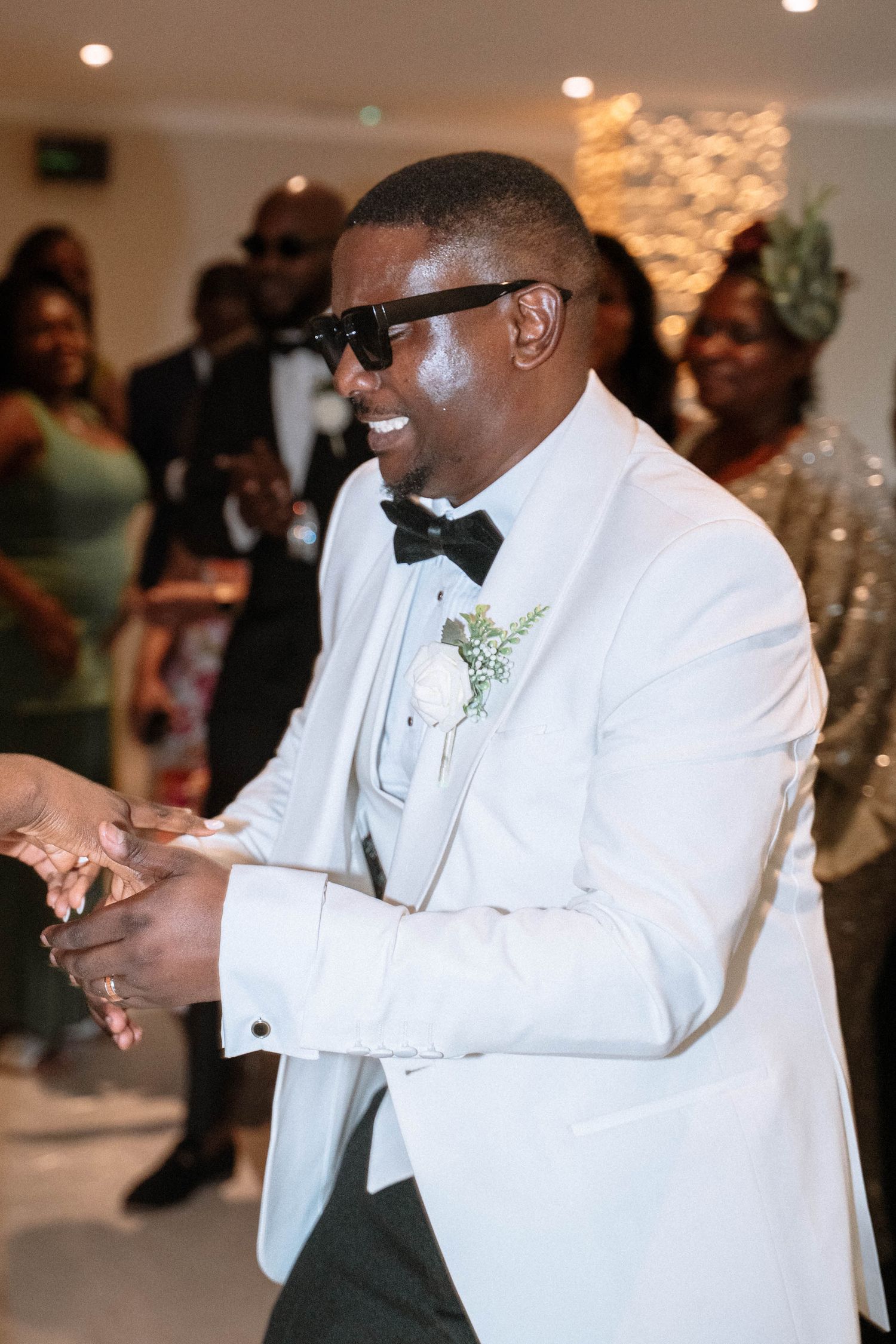Groom dancing during Ravens Ait wedding reception