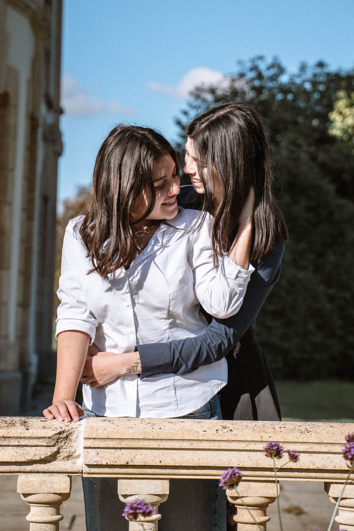 Couple embracing on balcony during Cardiff proposal photography