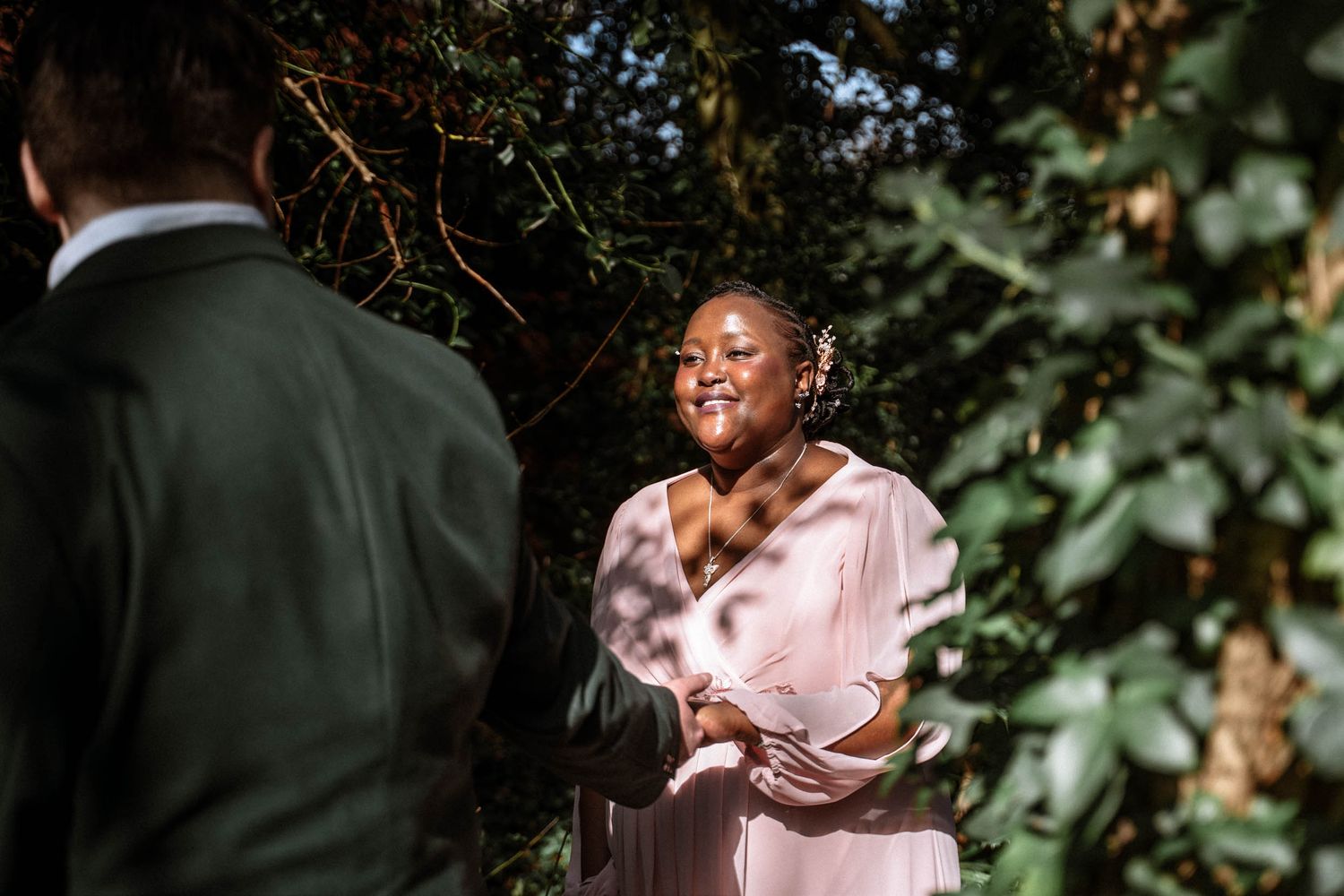 Bride smiling during emotional moment outdoors at Manchester wedding