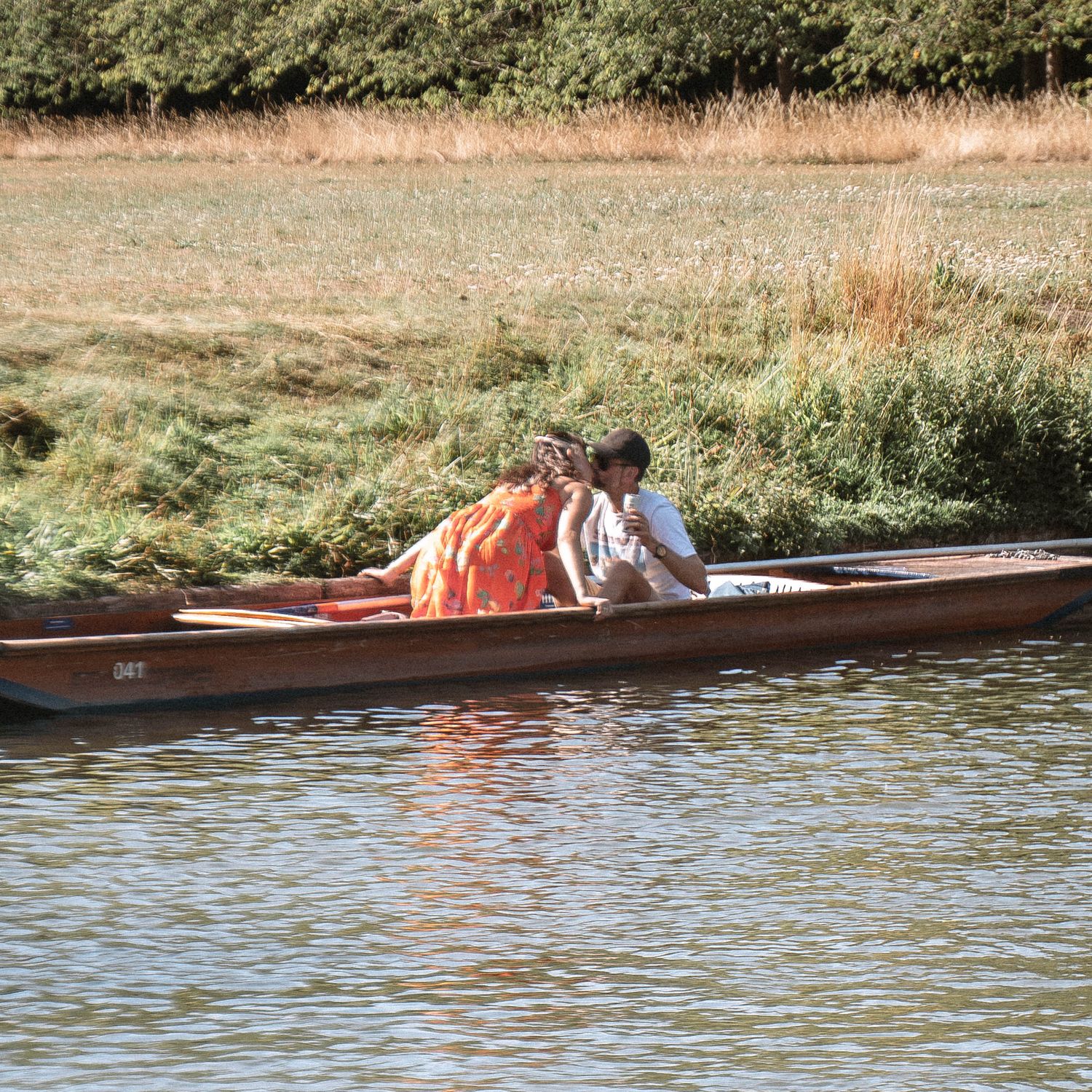 Couple punting on river during Cambridge engagement shoot