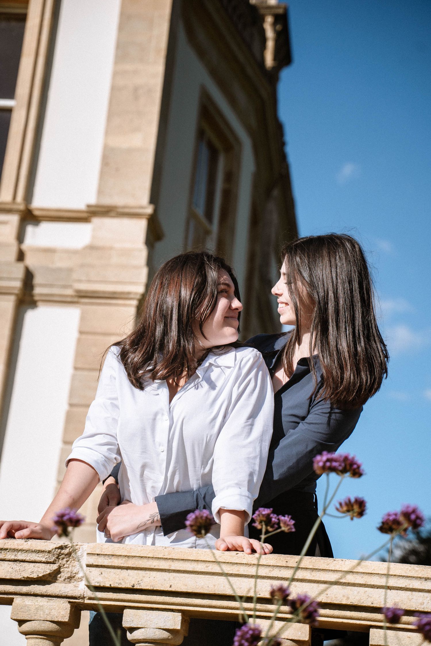 Couple standing on balcony during Cardiff proposal photography