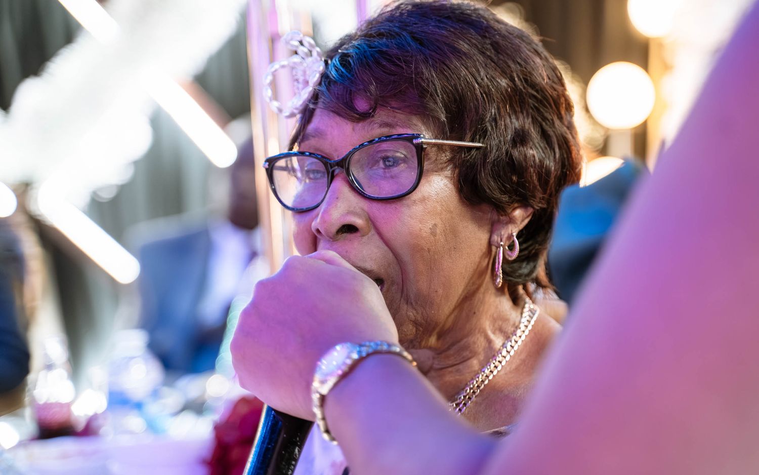 Elderly guest reacting emotionally during Jamaican wedding reception in Birmingham