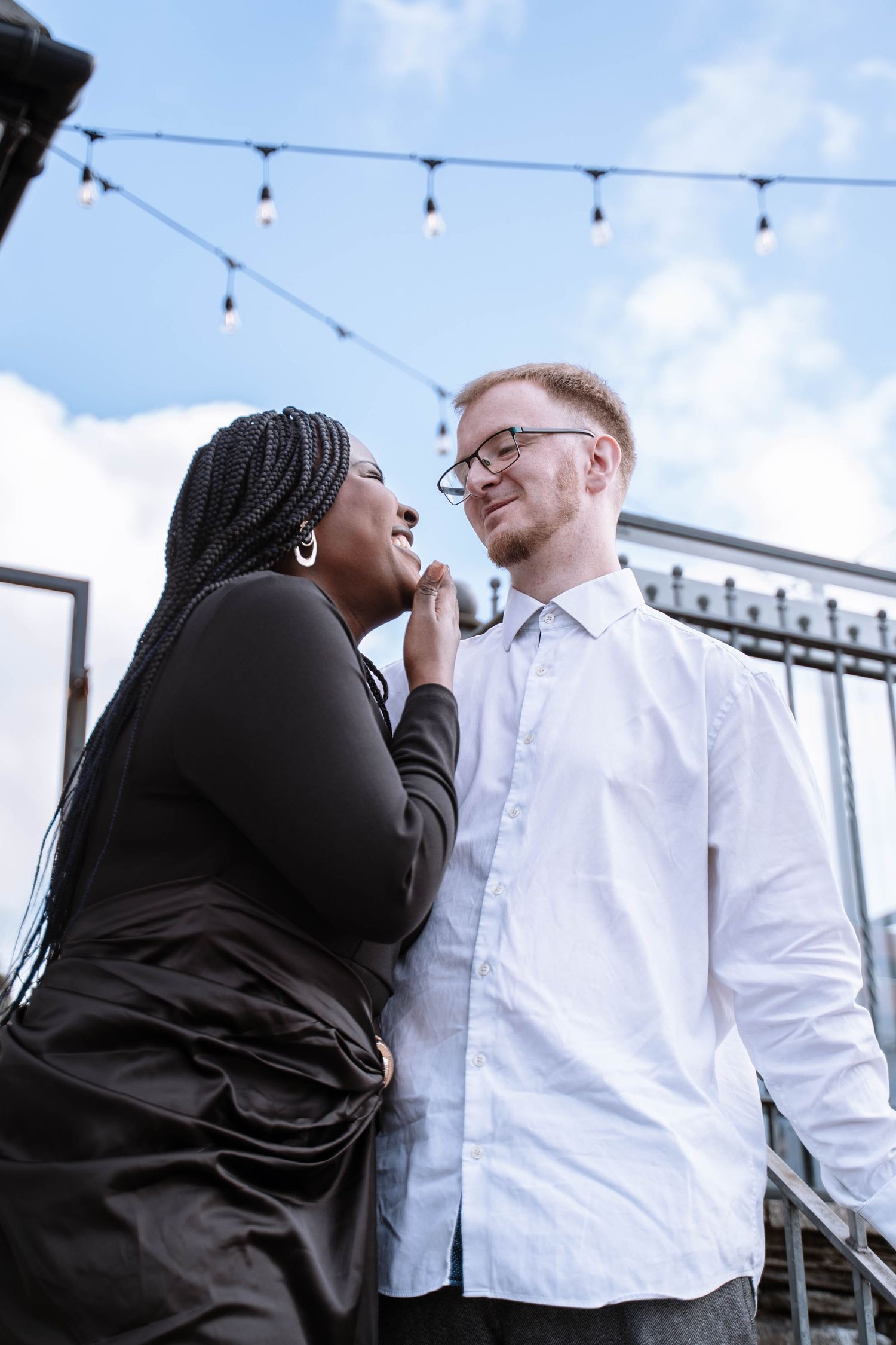 Interracial couple standing together outdoors in Windermere, Lake District