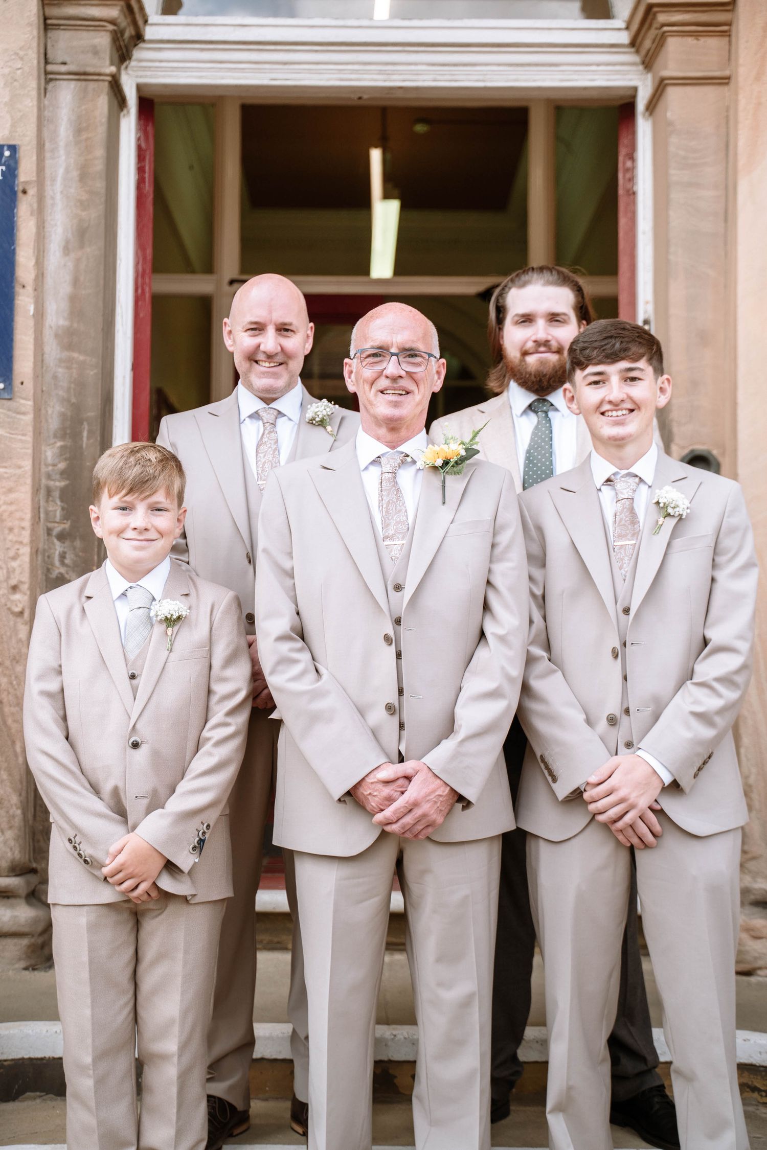 Groom standing with his wedding party outside Waterloo Town Hall