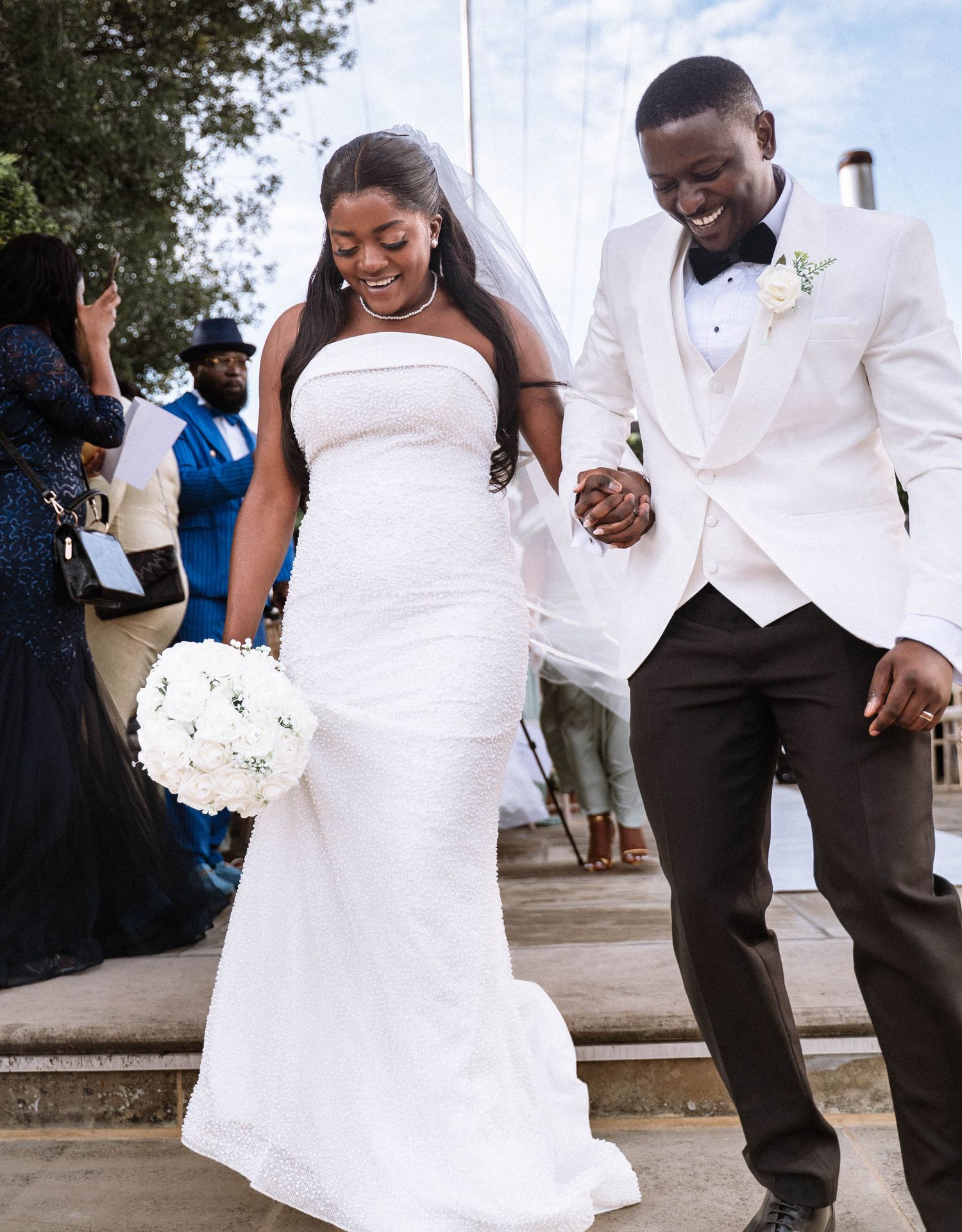 Ravens Ait wedding couple walking down steps just married bride and groom candid London wedding photography