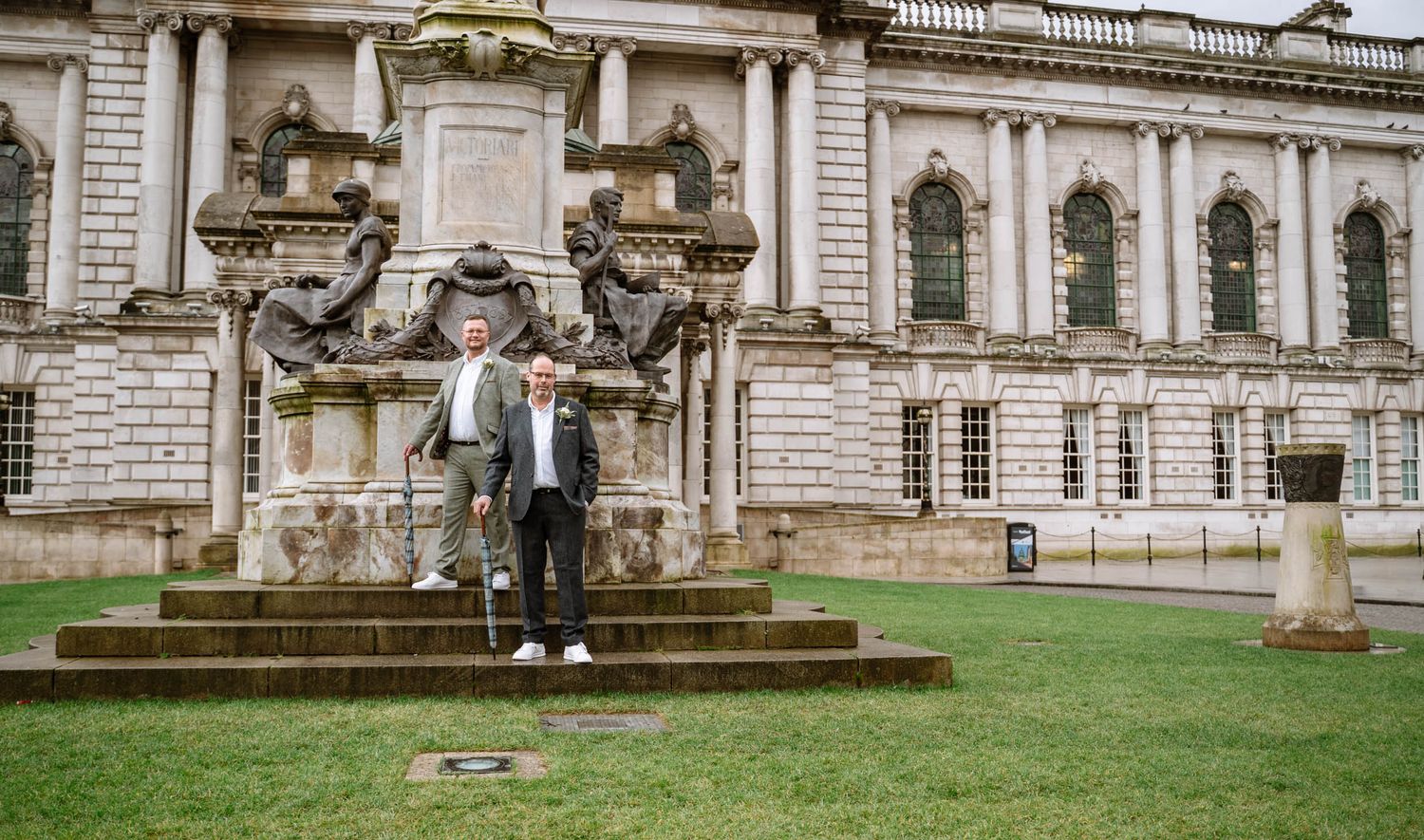 Two grooms standing outside Belfast City Hall