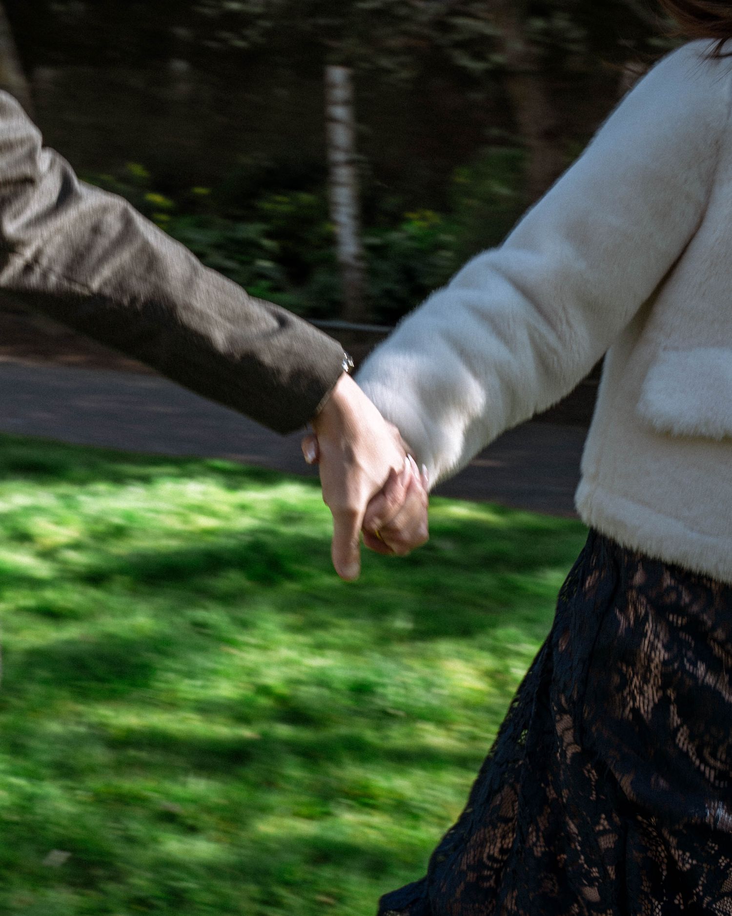 Close-up of hands reaching towards each other during a civil ceremony at Wandsworth Town Hall