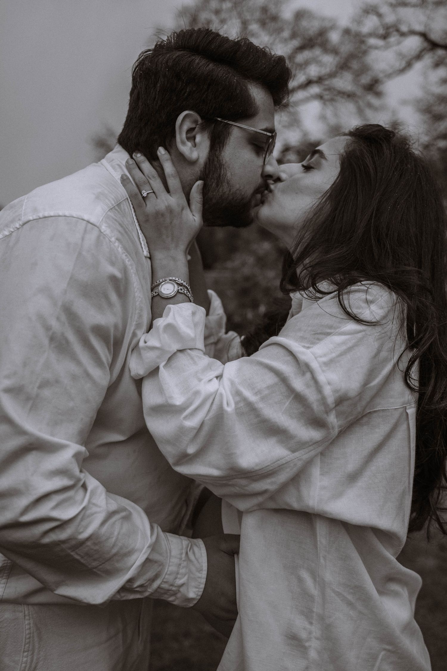 Couple kissing outside during their Manchester maternity photography session