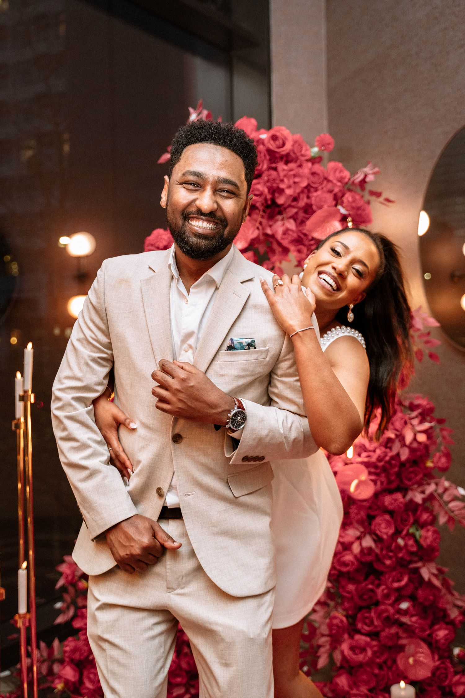 Couple sharing a playful moment after a Manchester proposal