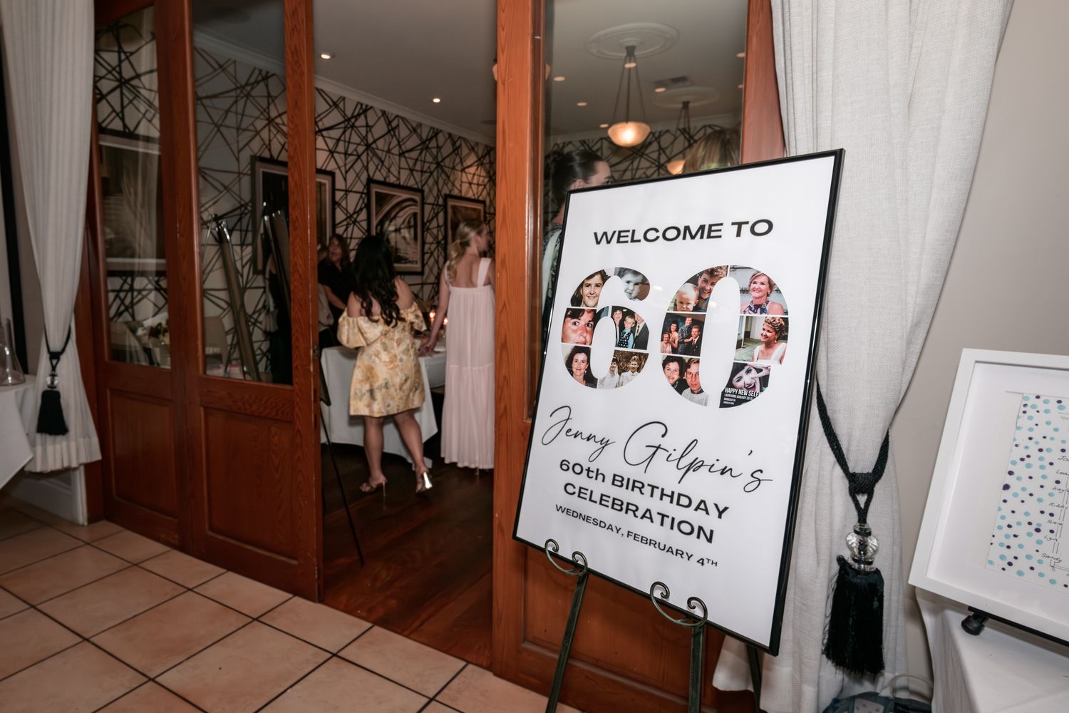 Welcome sign and photo display at entrance of special event venue.