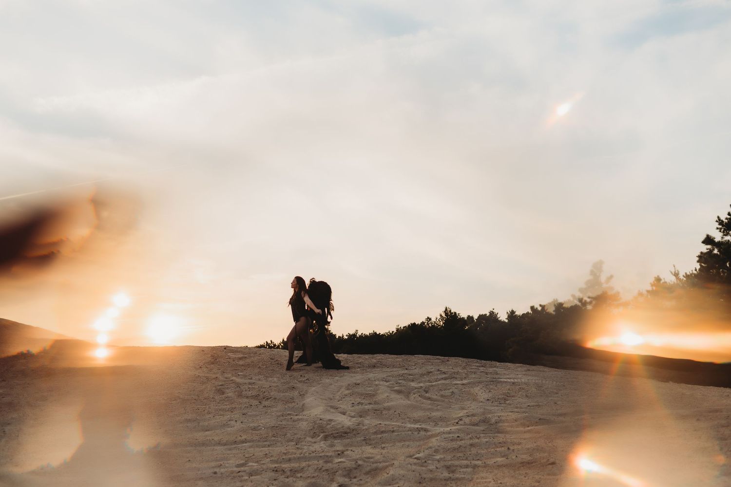 A panoramic series of sunset photos showing a silhouetted figure against a golden sky over rolling hills.