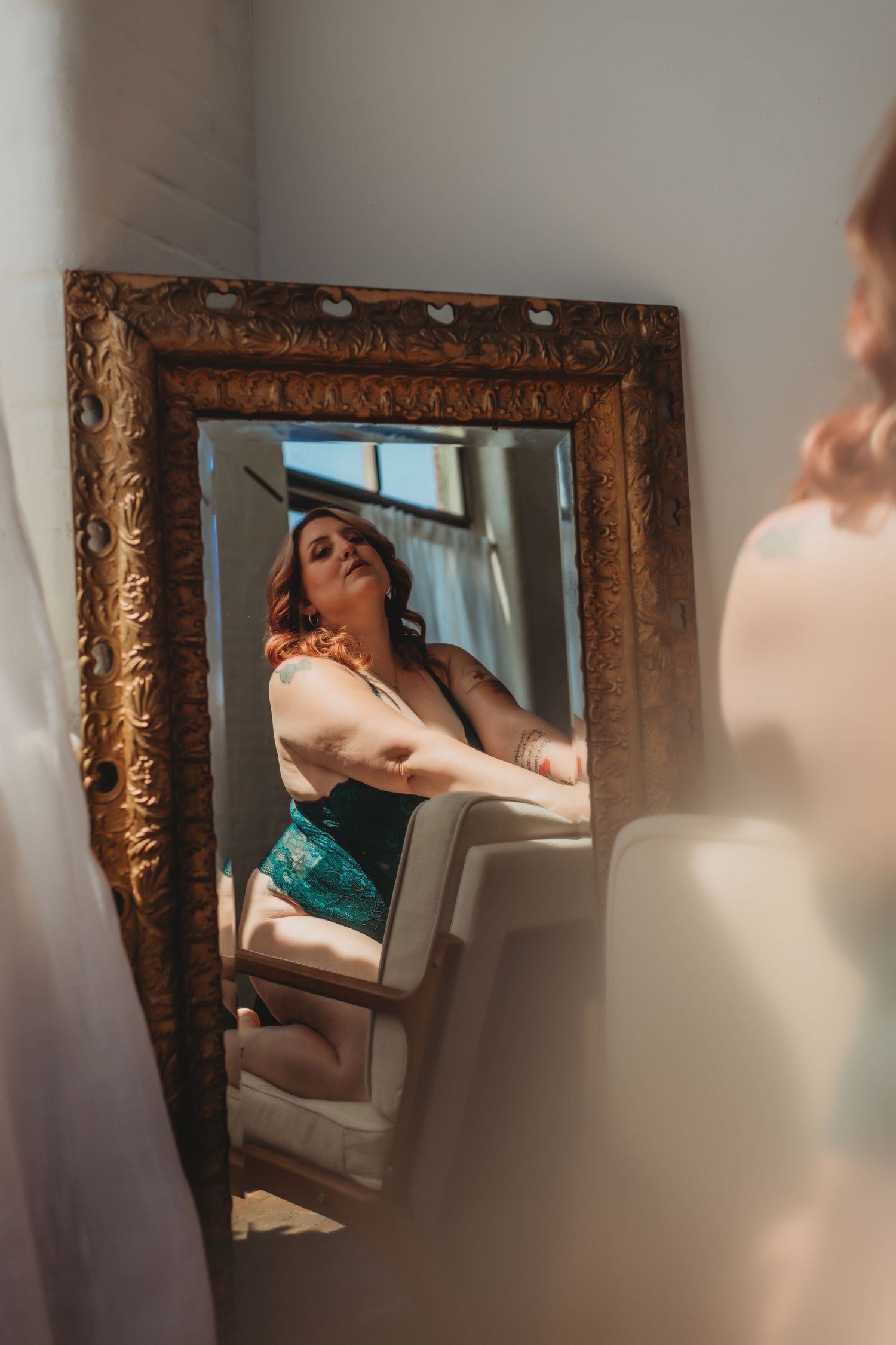 Artistic boudoir photo series showing reflections in an ornate gold mirror against soft neutral walls.