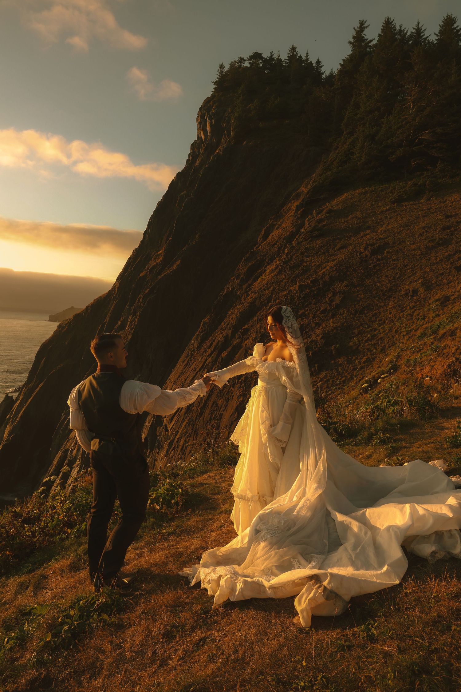 Couple celebrating their Oregon Coast elopement with waves and coastal cliffs behind them