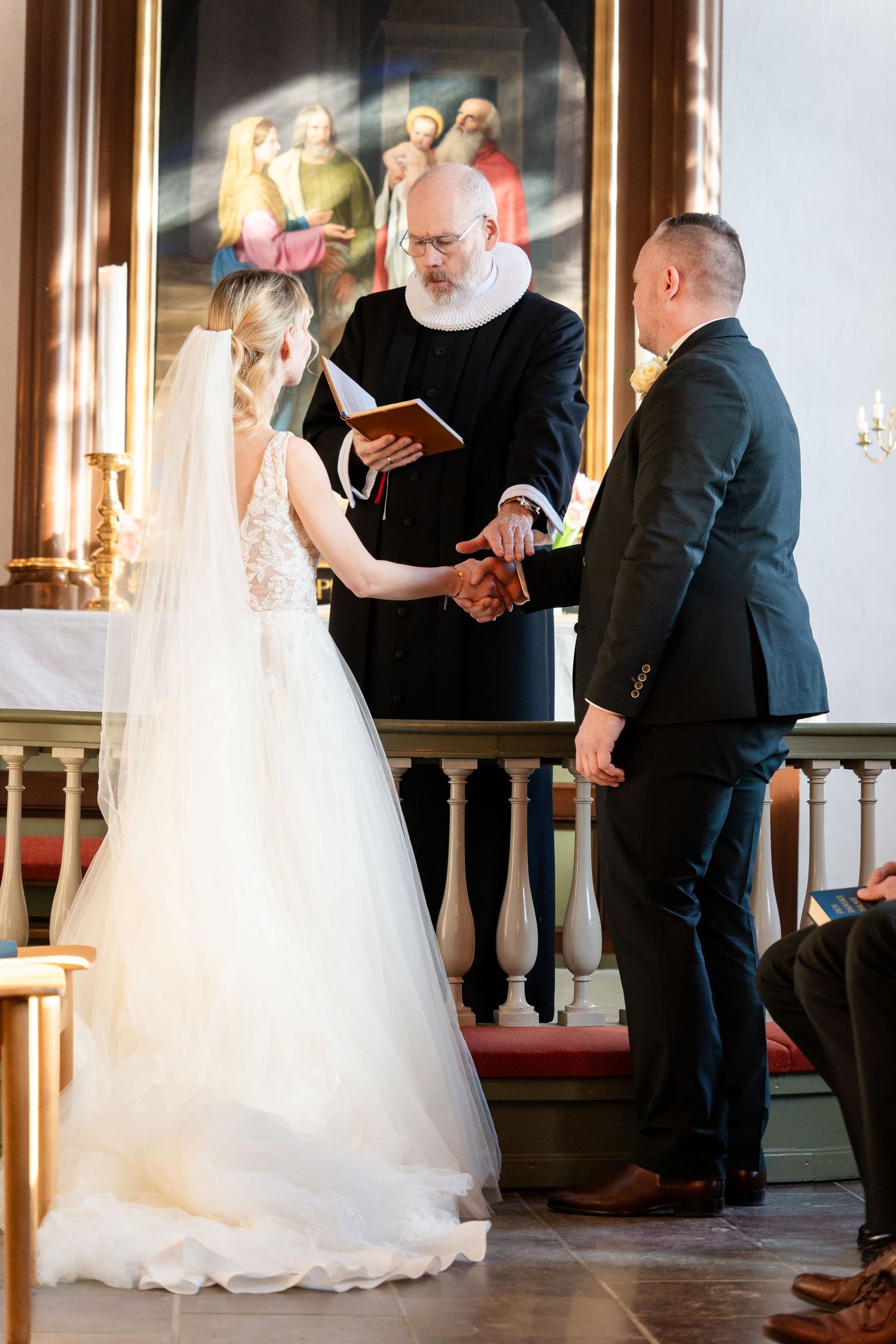 Wedding ceremony moments captured in sequence at an elegant indoor venue.