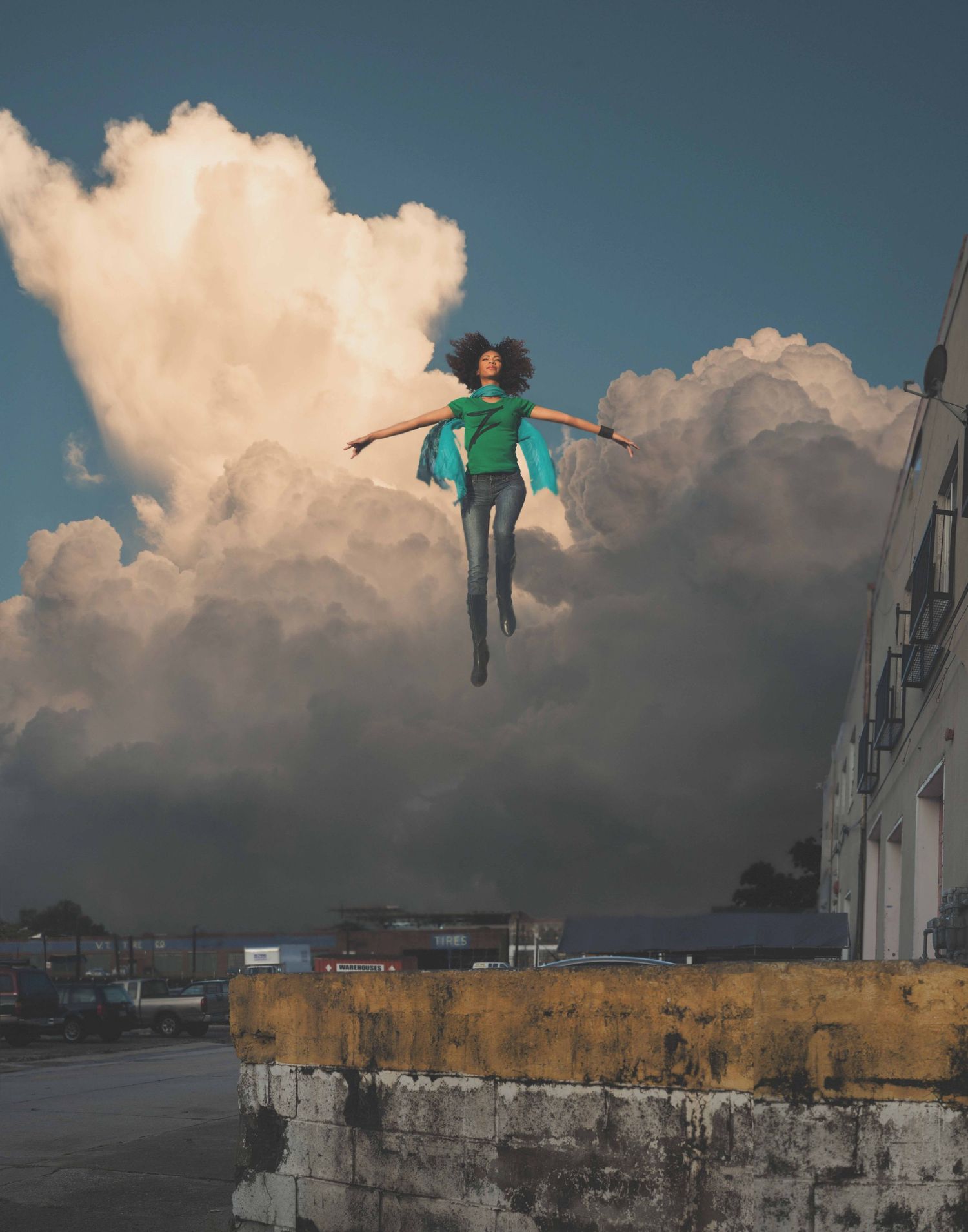 Artistic panoramic shots of a person flying in the air against dramatic cloudy skies.