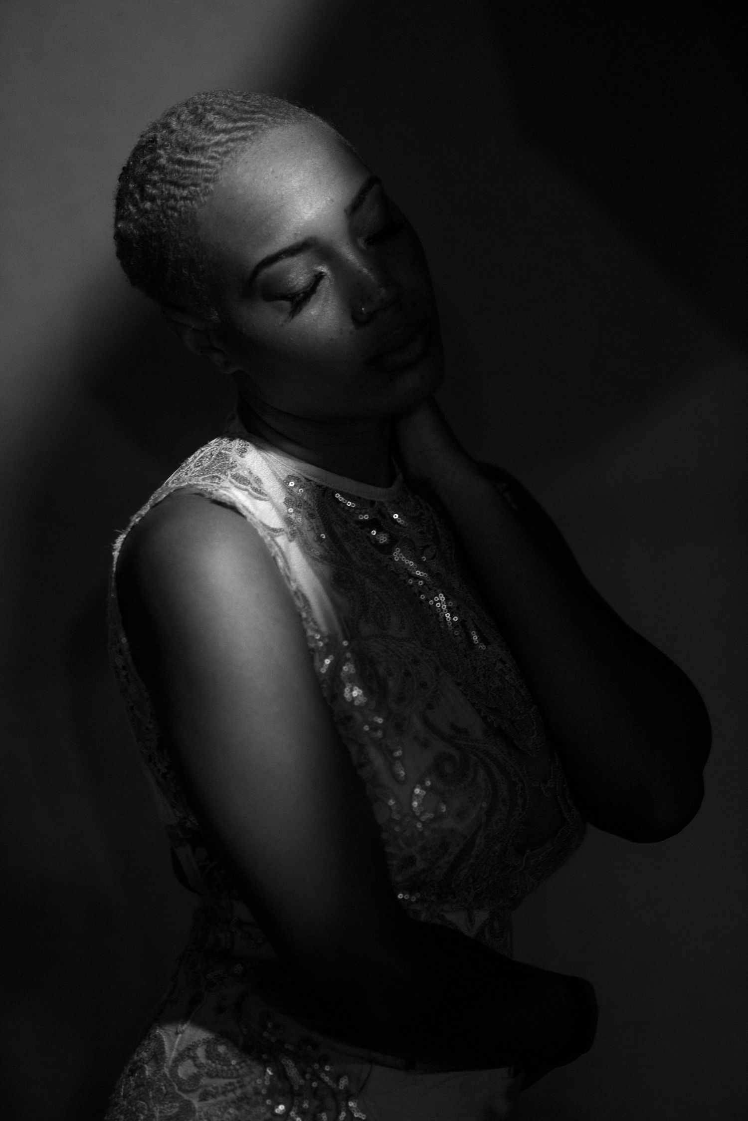 Dramatic black and white artistic portrait with moody lighting and expressive poses.