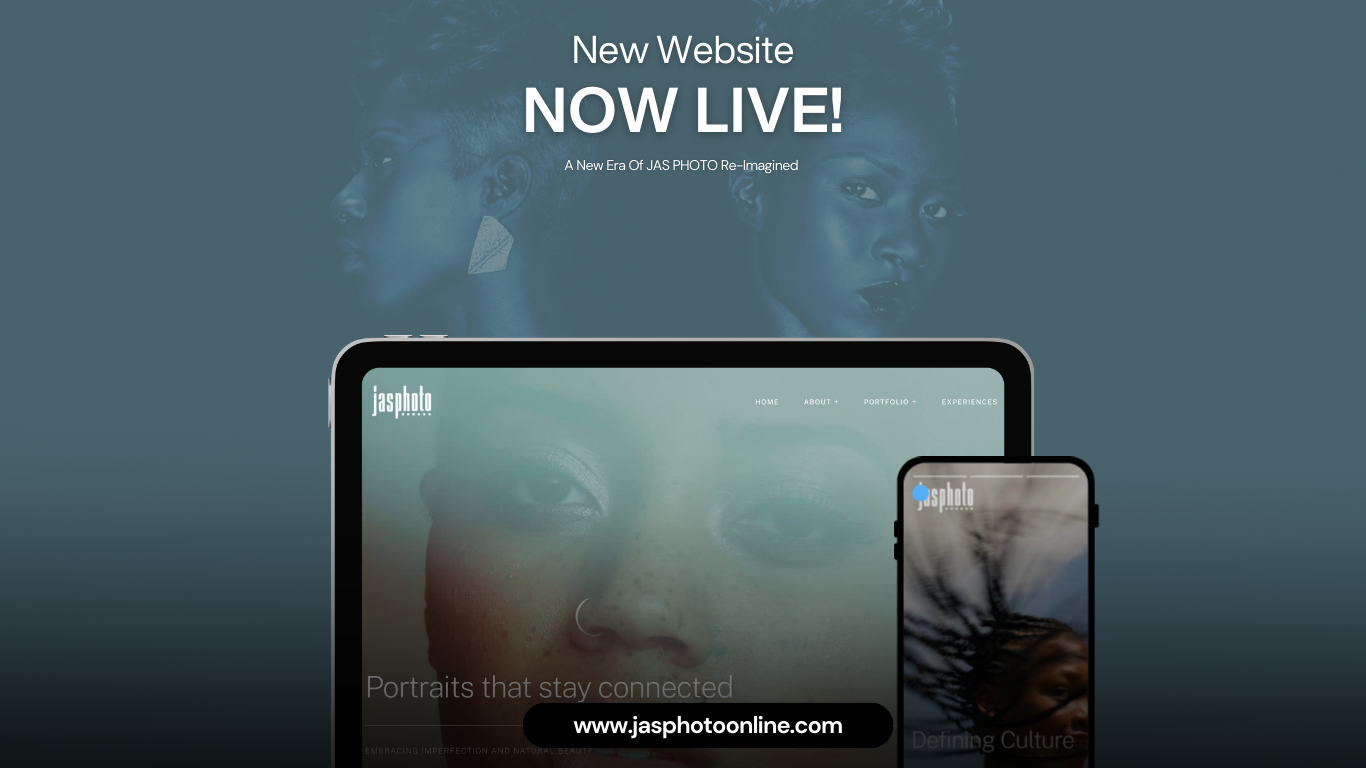 A mockup of a responsive website design showing a dark website layout on laptop and mobile phone screens.