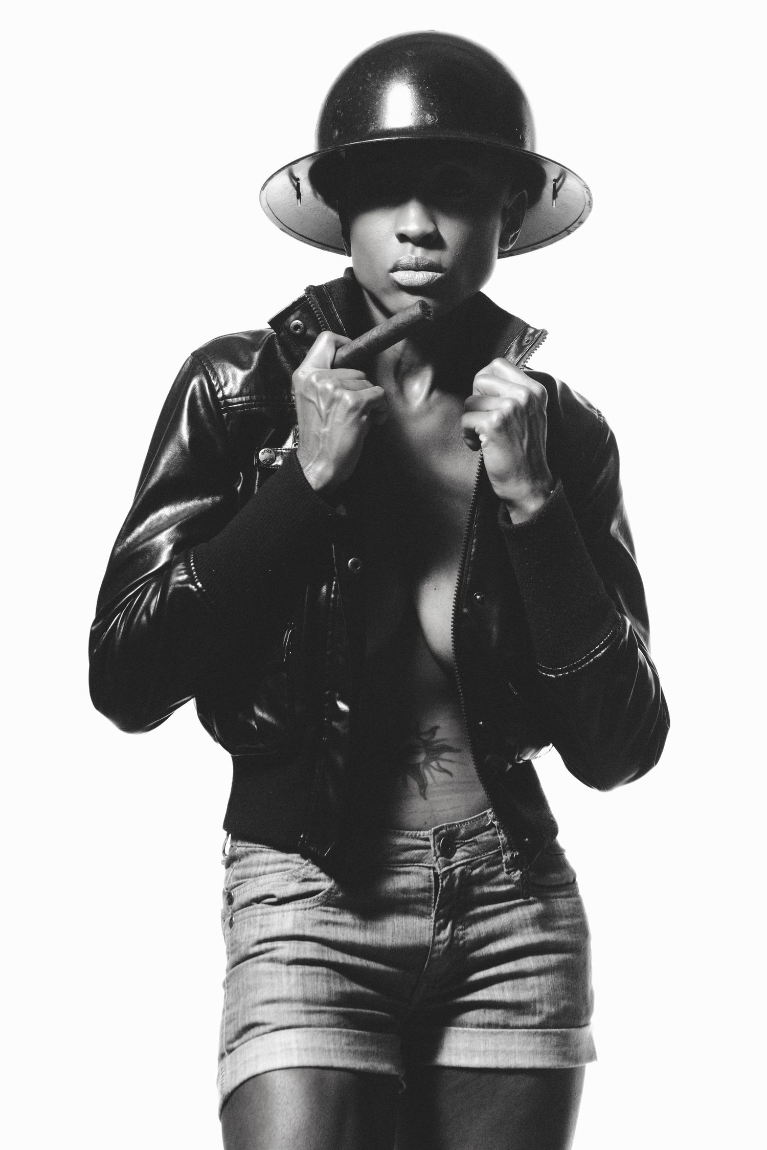 Black and white series of person in black helmet and denim striking dynamic poses.