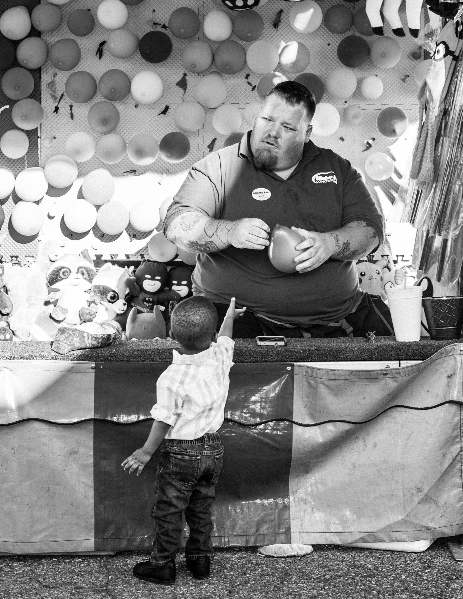 black and white photos show someone sitting on a bench with balloons in the background at an event.