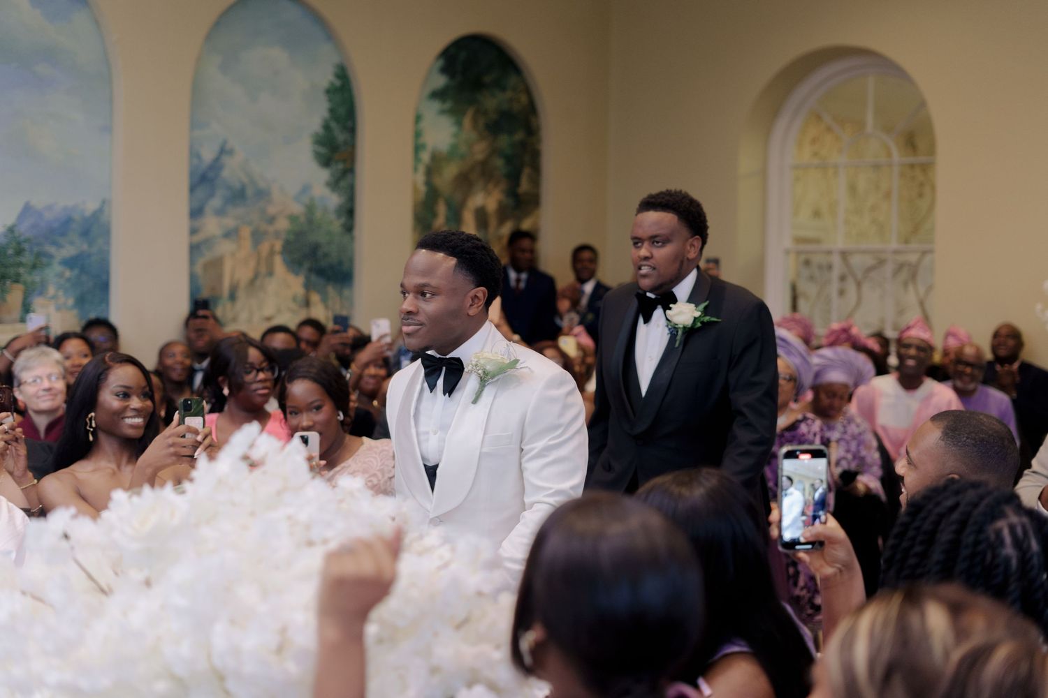 groom and best man walking down aisle