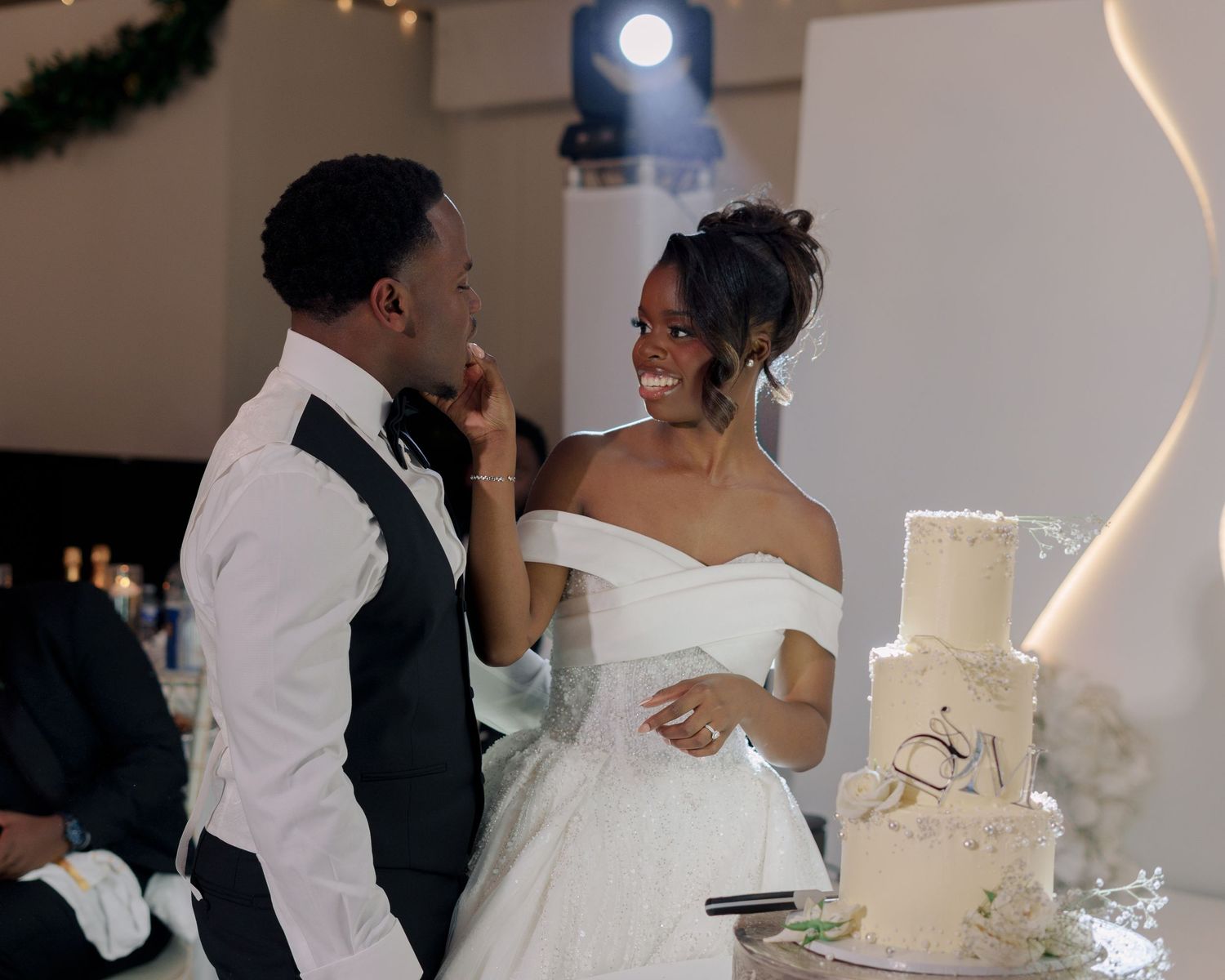 bride feeding her groom cake.