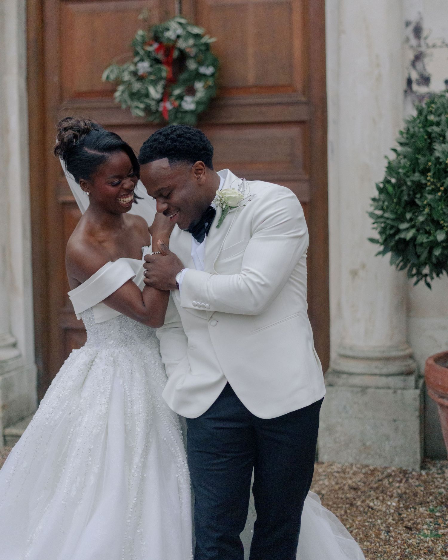 bride and groom laughing