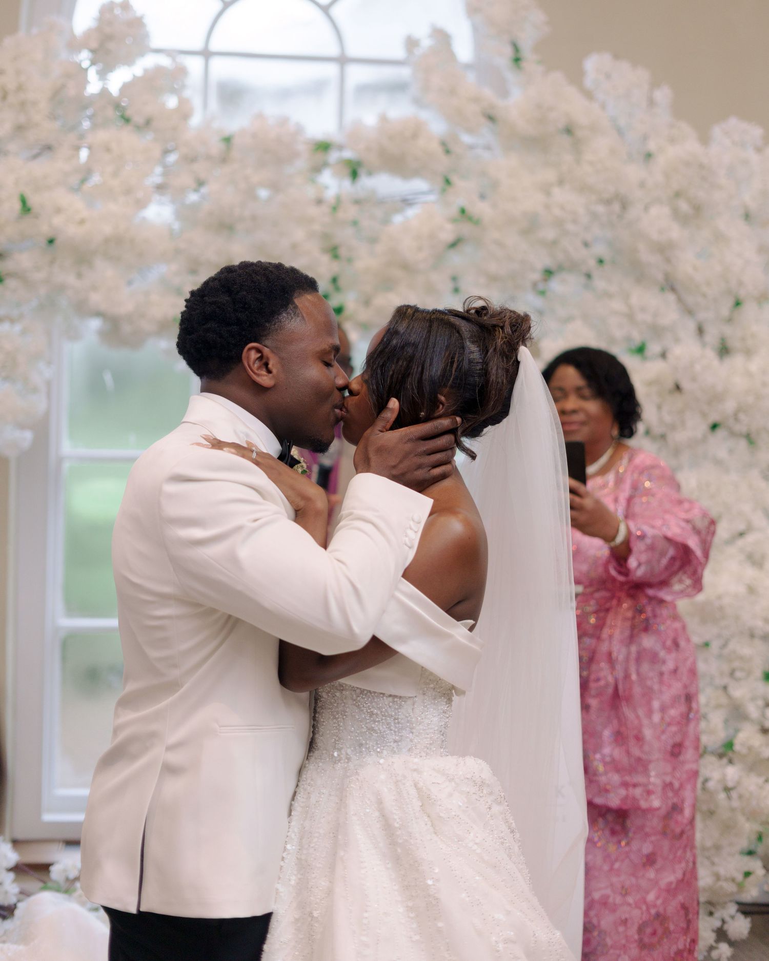 couple kissing at the altar