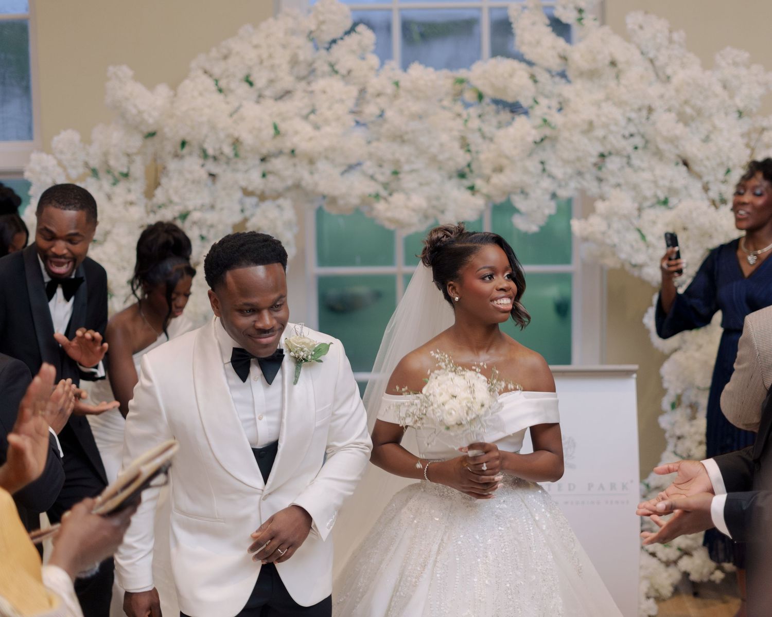 couple dancing down aisle after being announced husband and wife.