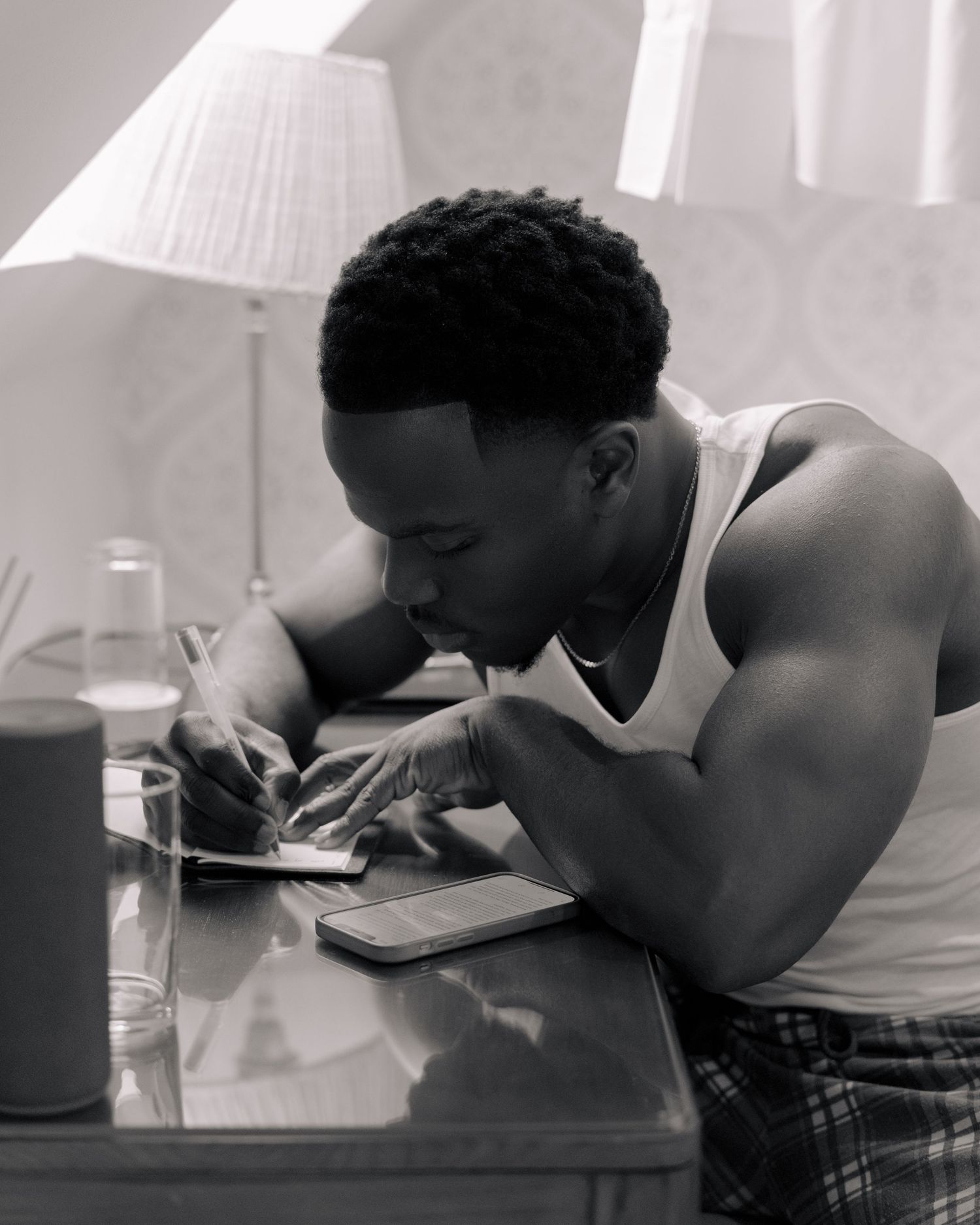 groom writing his vows on morning of wedding