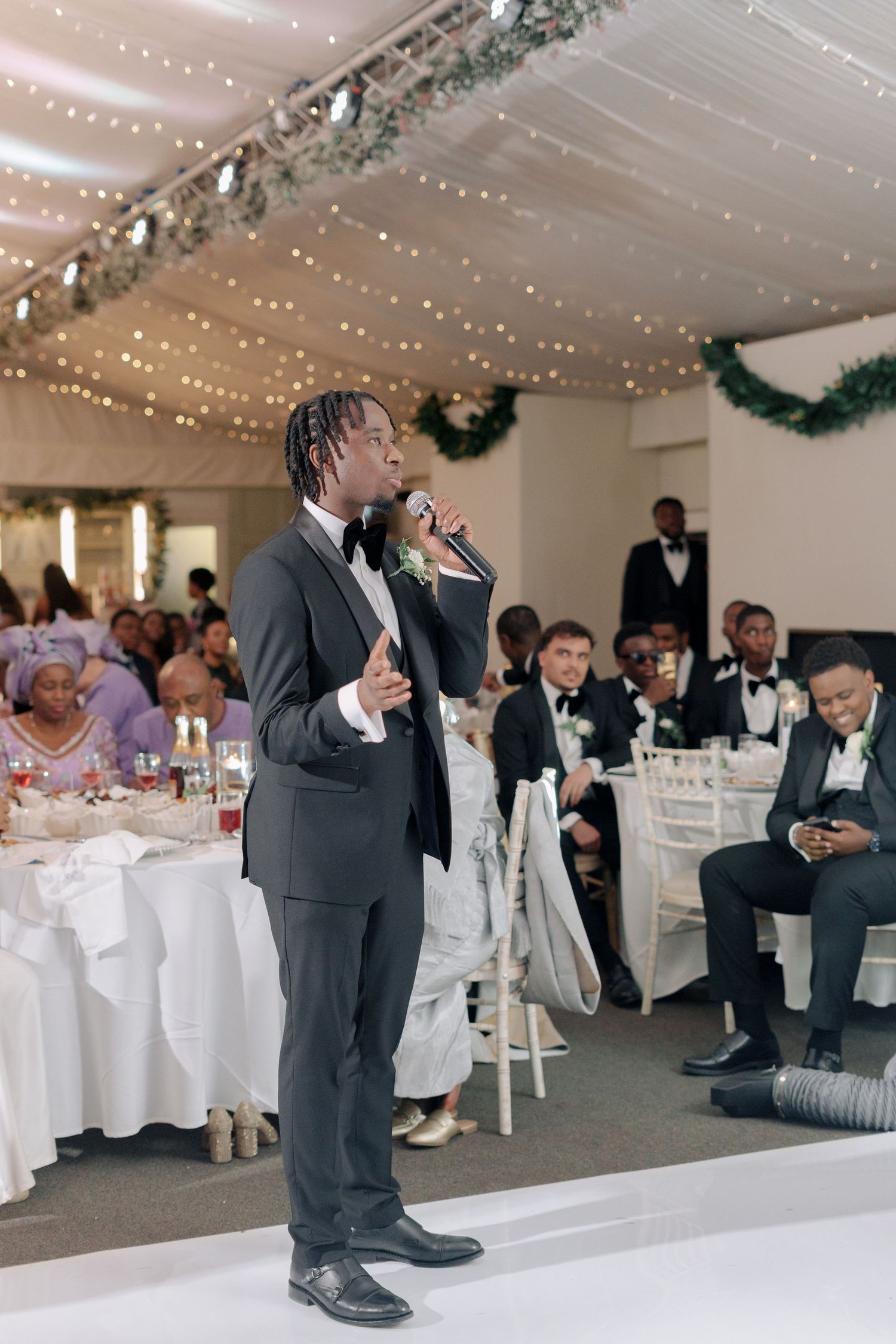 best man sharing speech at wedding reception