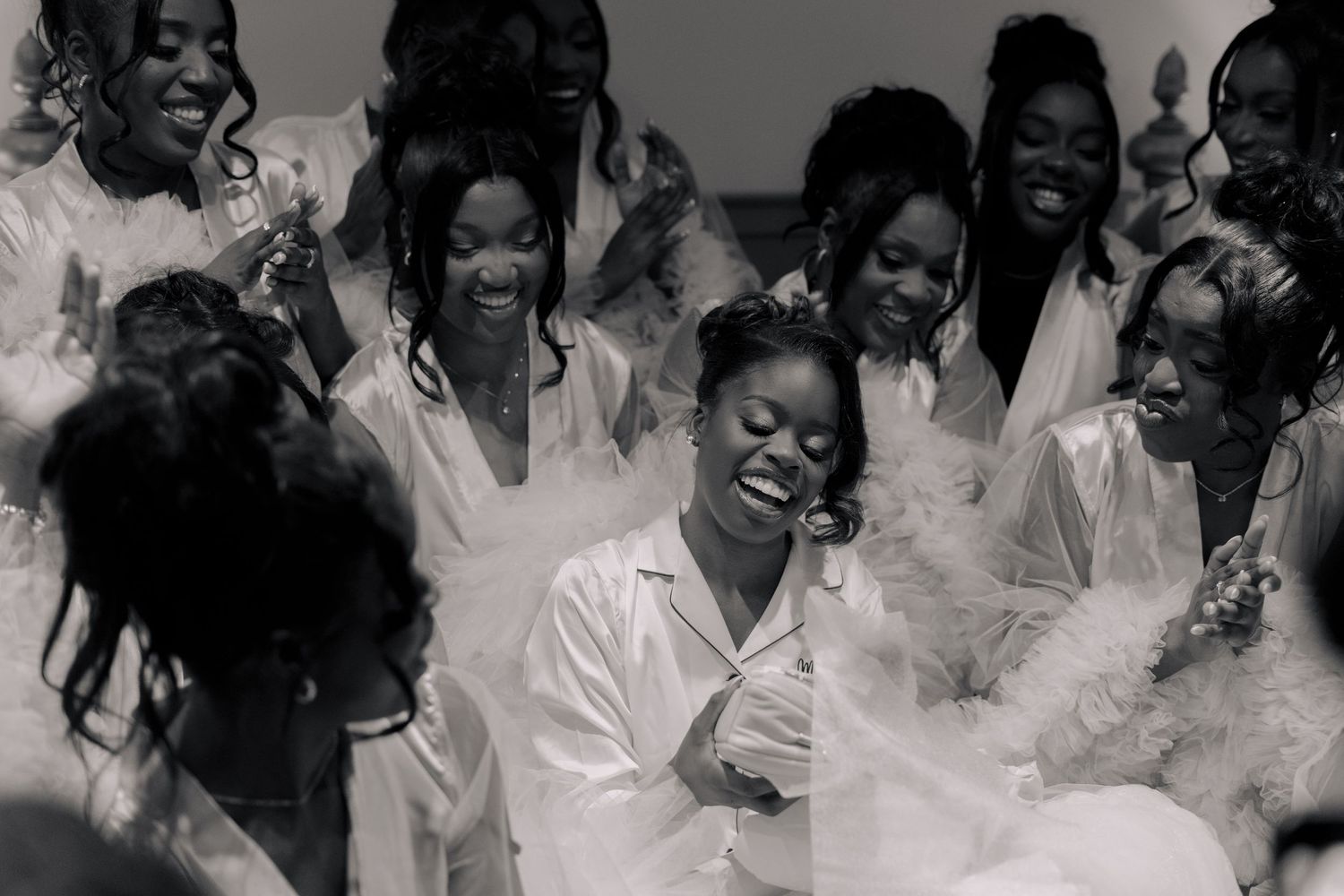 black and white pictures of bride and her girls in robe