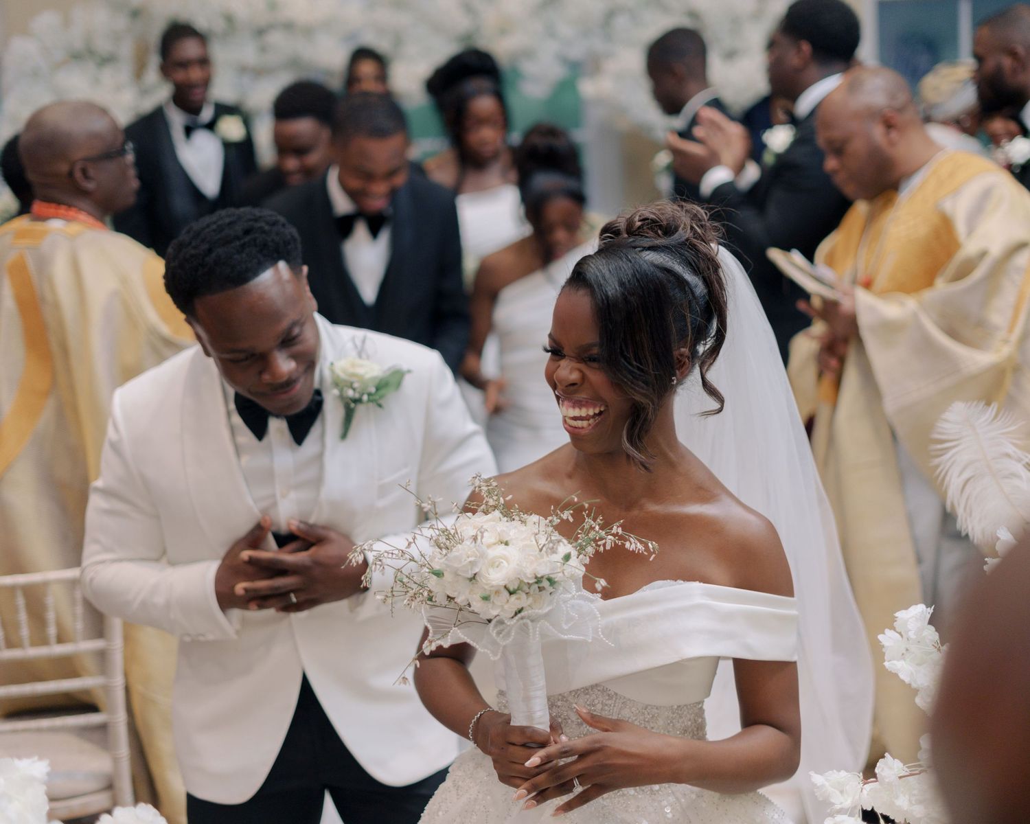 couple dancing down aisle after being announced husband and wife.