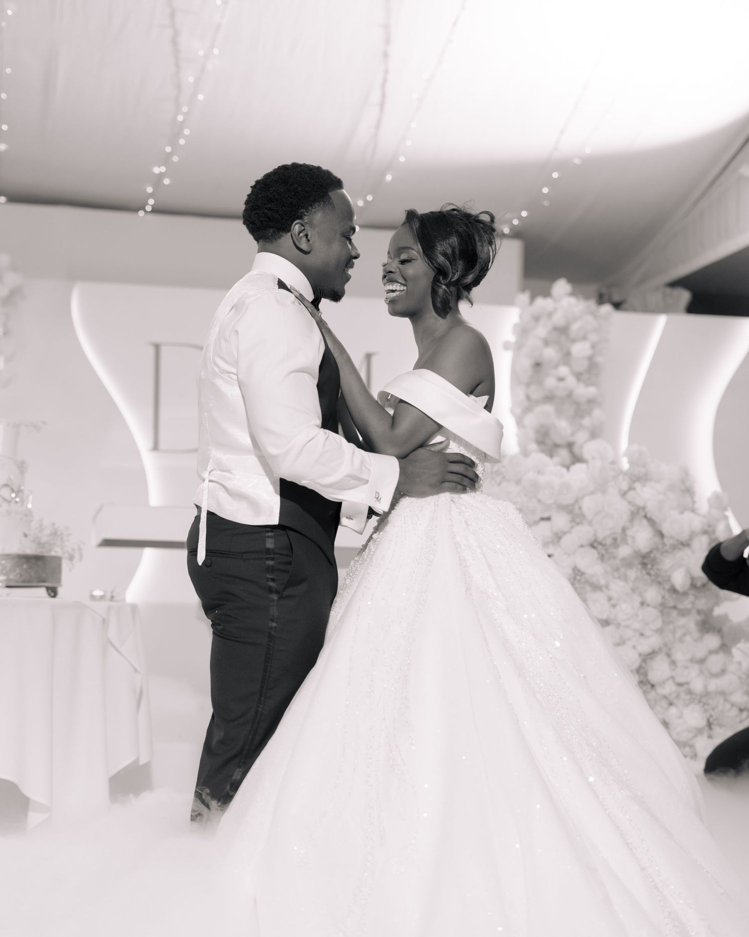black and white picture of bride and groom first dance