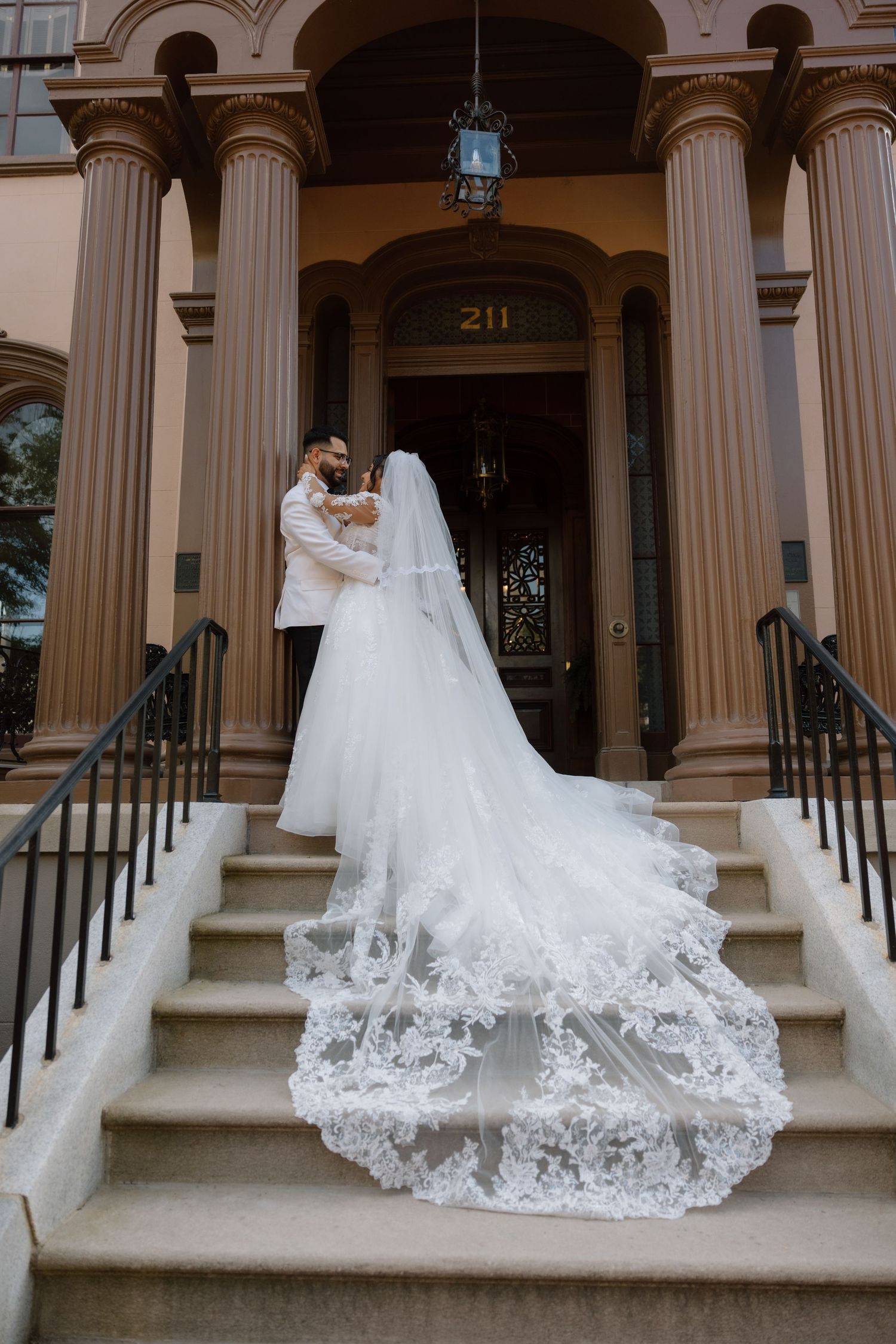 A bride and groom in front of the Bolling Haxall House in Richmond Virginia.