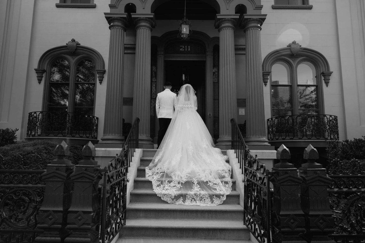 A bride and groom in front of the Bolling Haxall House in Richmond Virginia.