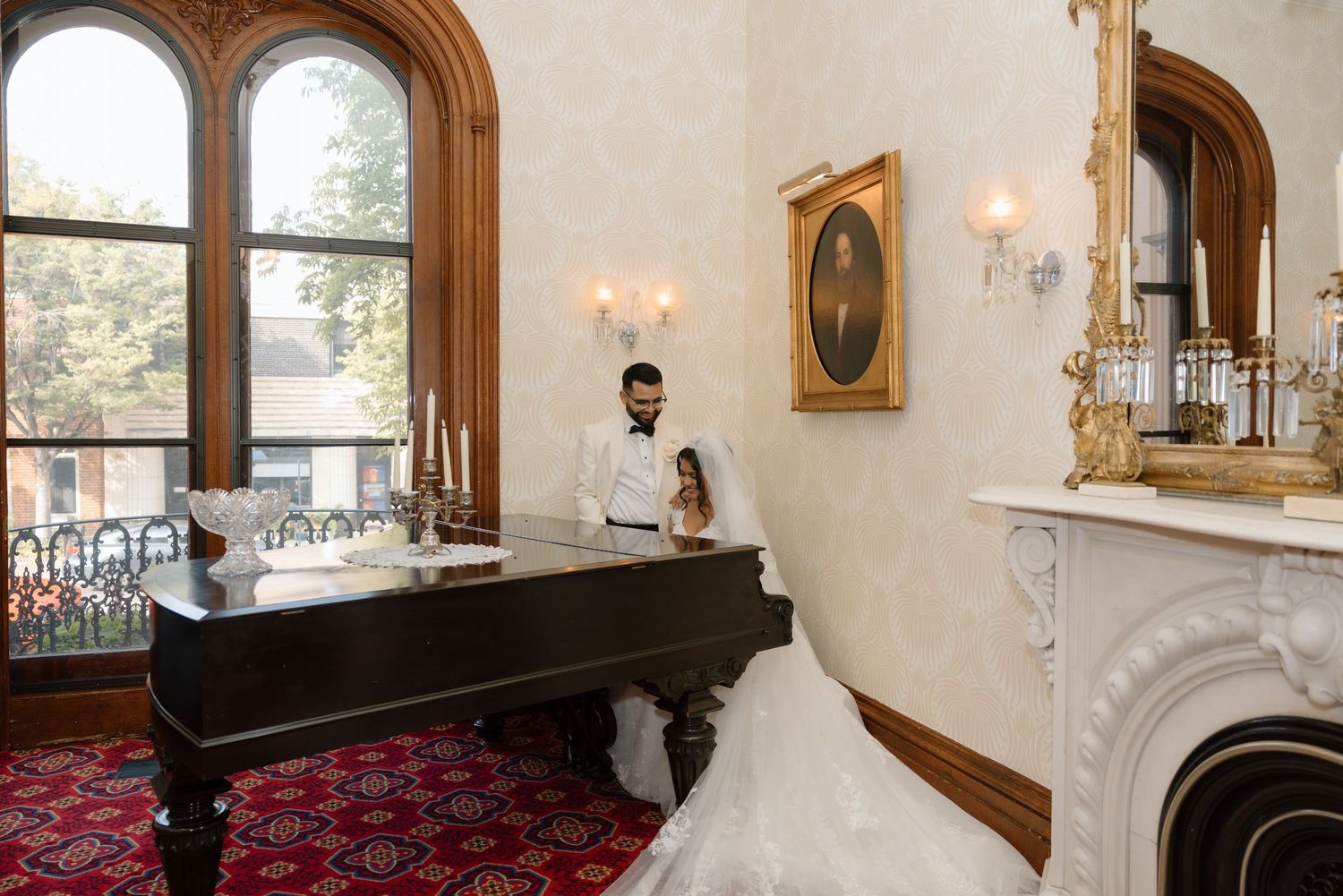 A bride and groom in front of a piano at the Bolling Haxall House in Richmond Virginia.
