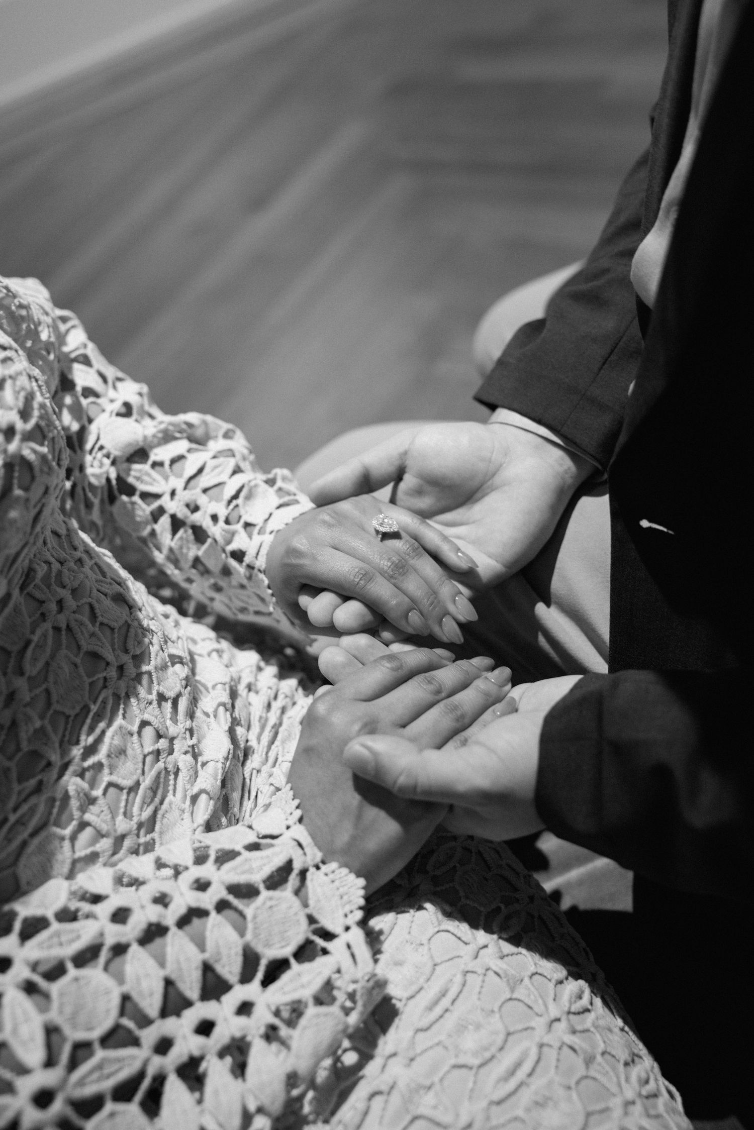 A couple holding hands for their engagement session at the Virginia Museum of Fine Arts in Richmond Virginia.