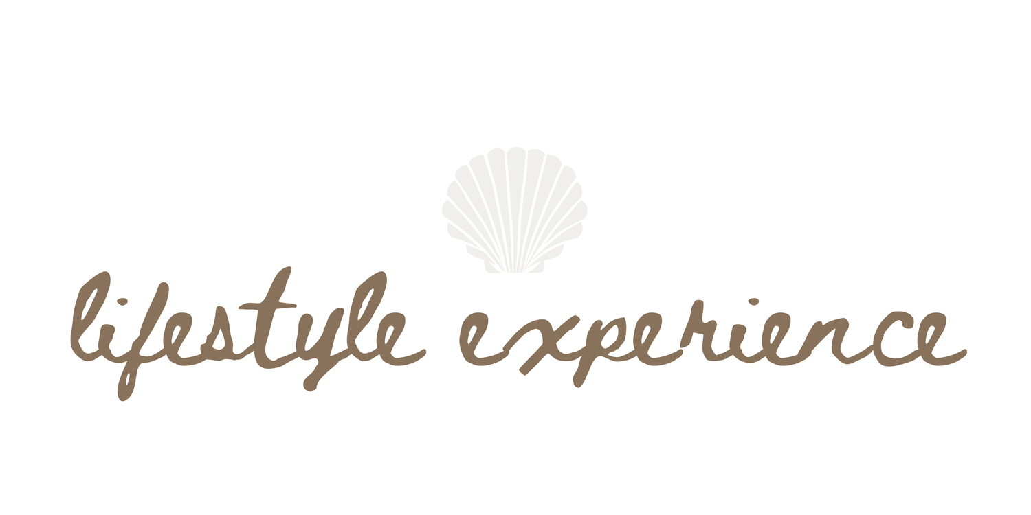 Lifestyle Experience logo with cursive text and a decorative seashell icon in neutral beige tones.