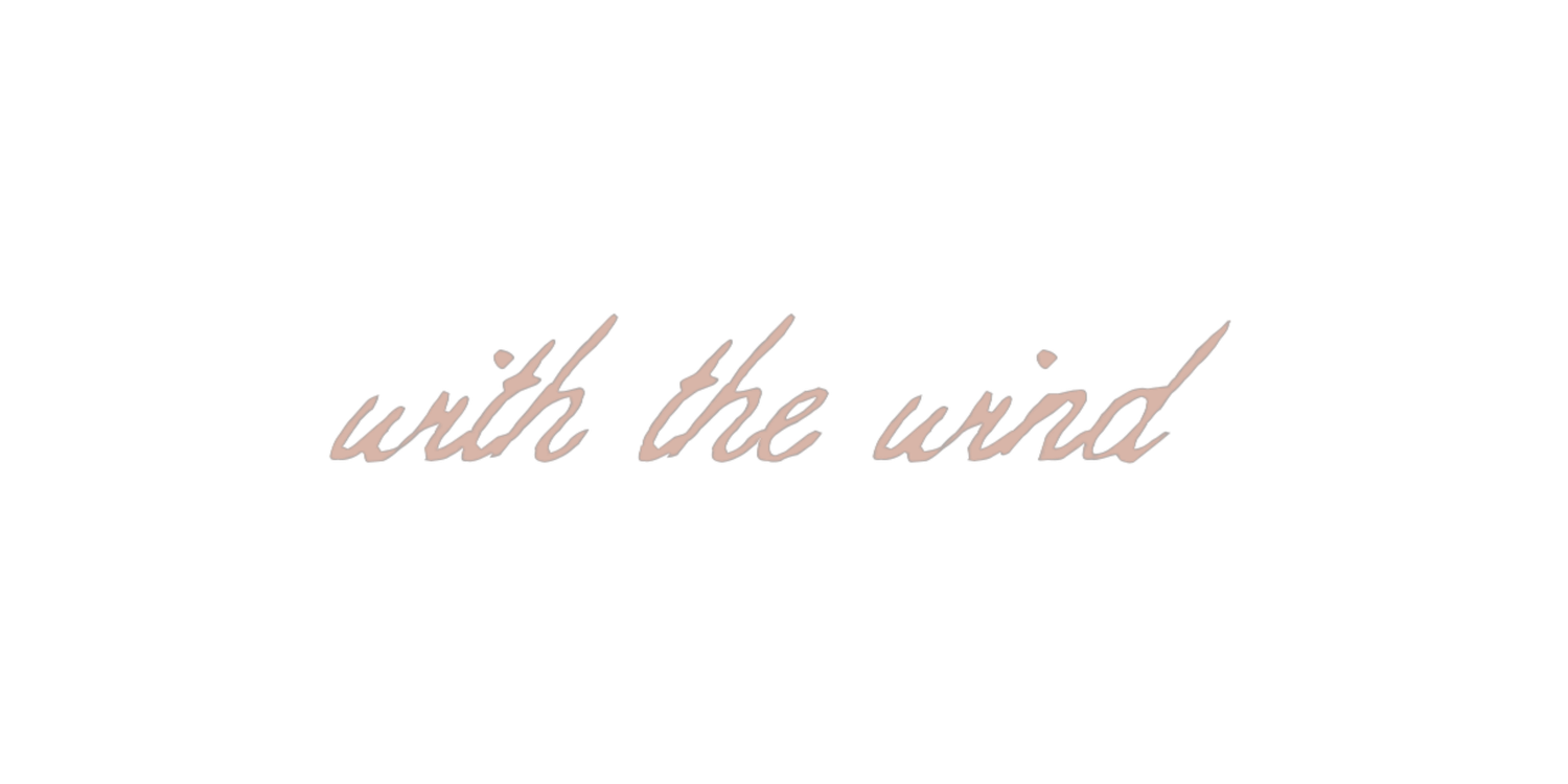 Elegant cursive script text reading 'with the wind' in soft pink on a white background.
