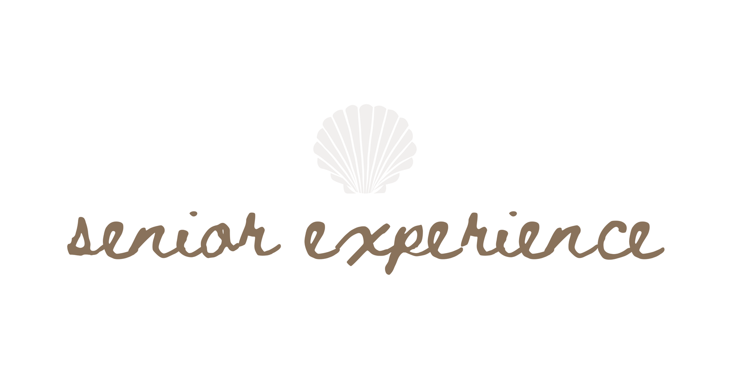 Senior Experience logo with a seashell icon and elegant script typography in warm brown tones.