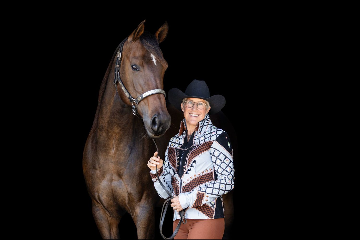 Horse and handler portraits taken in a dark studio setting.