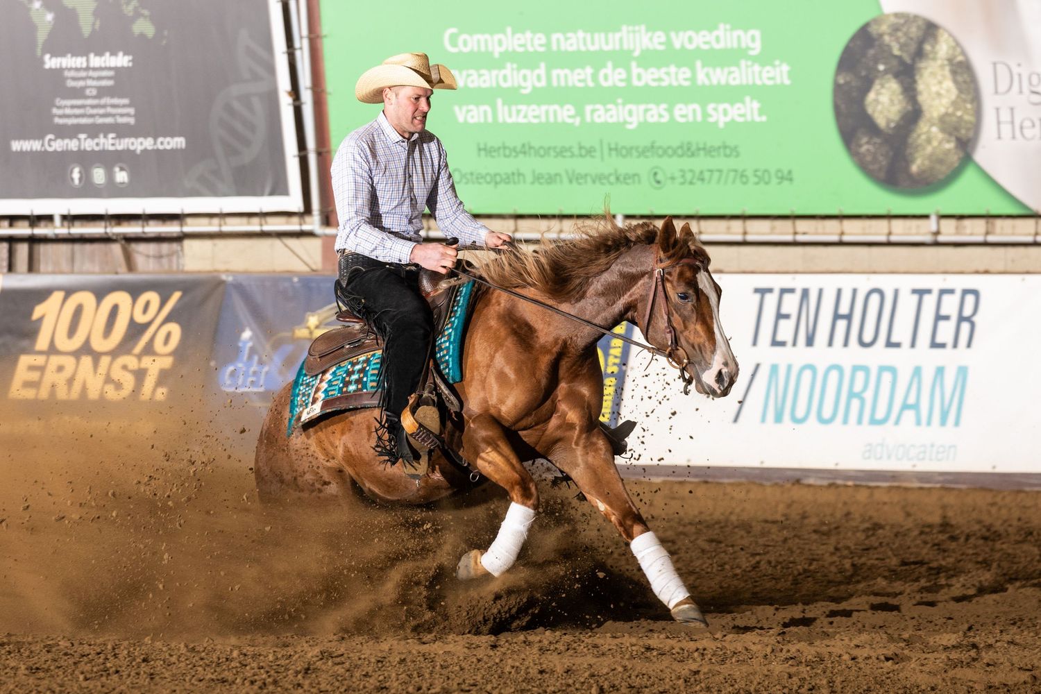 Horse and rider compete in a western rodeo arena during a barrel racing competition.